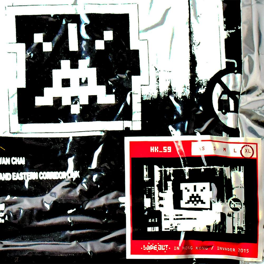 A very limited number of Invader t-shirts were released for each size in 2015 for his Wipe Out exhibition in Hong Kong. 
This is a rare black XL.
Graphic is of the Invader street mosaic # hk_59 that the artist installed in Hong Kong. It features a