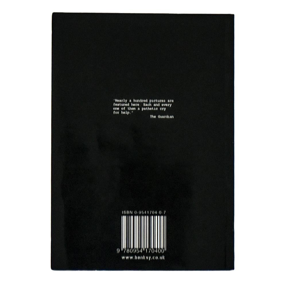 Very cool and collectible book, Banksy’s Banging Your Head Against a Brick Wall.
Released in 2001.
This is Banksy's first book.
He released 3 books in this mini black book format in the 2000's (Banging Your Head Against a Brick Wall, Existencilism