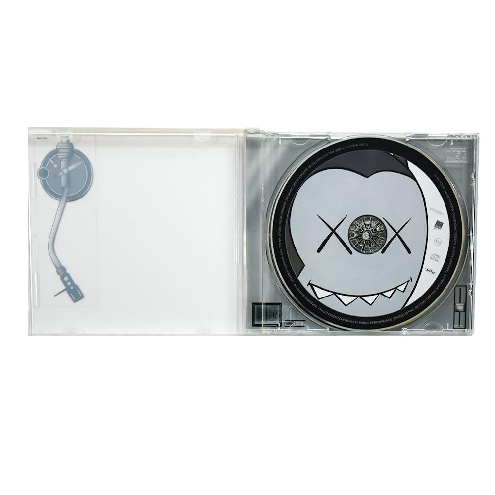 Super clever and rare cd featuring artwork by Kaws.
Early example of Kaws art released in 2002.
Exclusive Japan only release.
Cleverly makes the cd case look like a turntable.
Also has Kaws art on the cd itself.
Comes with OBI (spine card) as
