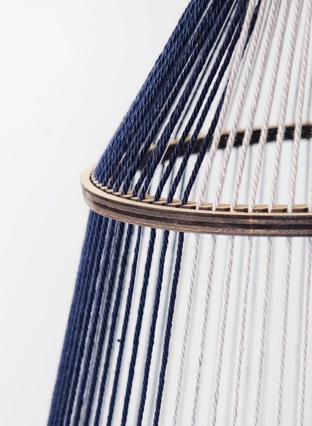 This intricate woven thread contemporary abstract sculpture is an original artwork by Peruvian-Canadian artist Sofia Escobar. Hundreds of pieces of thread and wool have been carefully handwoven in a delicate exploration of light and form. This