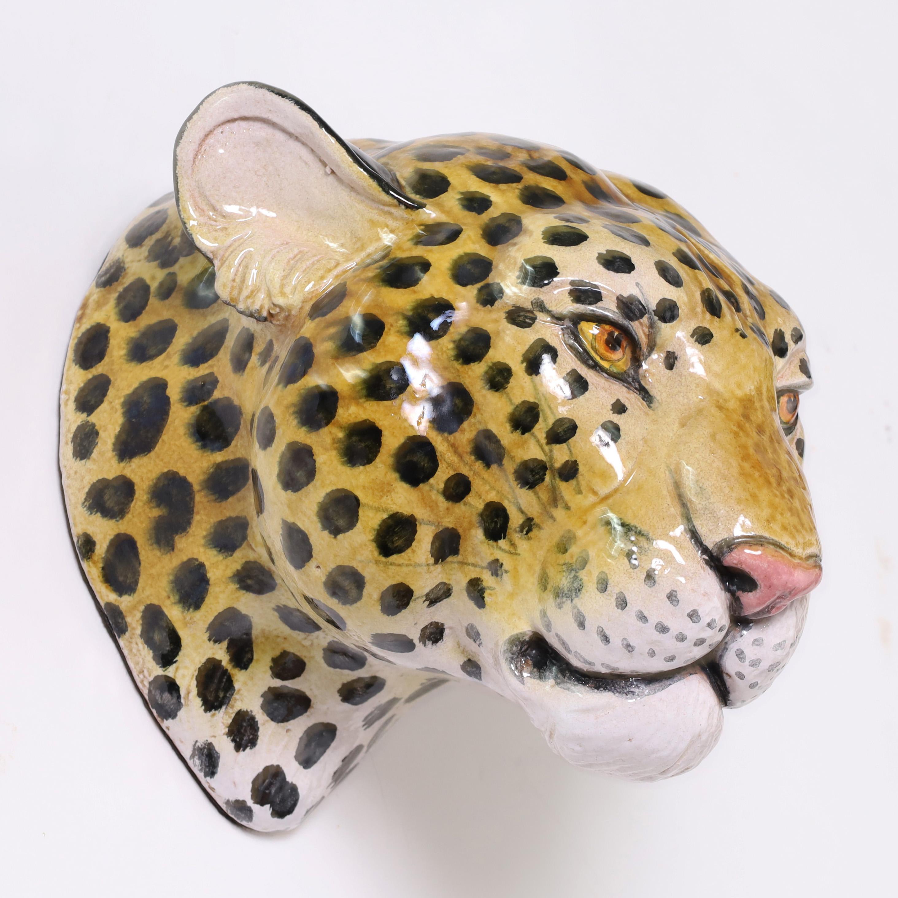 Handsome mid century Italian leopard head crafted in terra cotta and hand decorated under glaze.