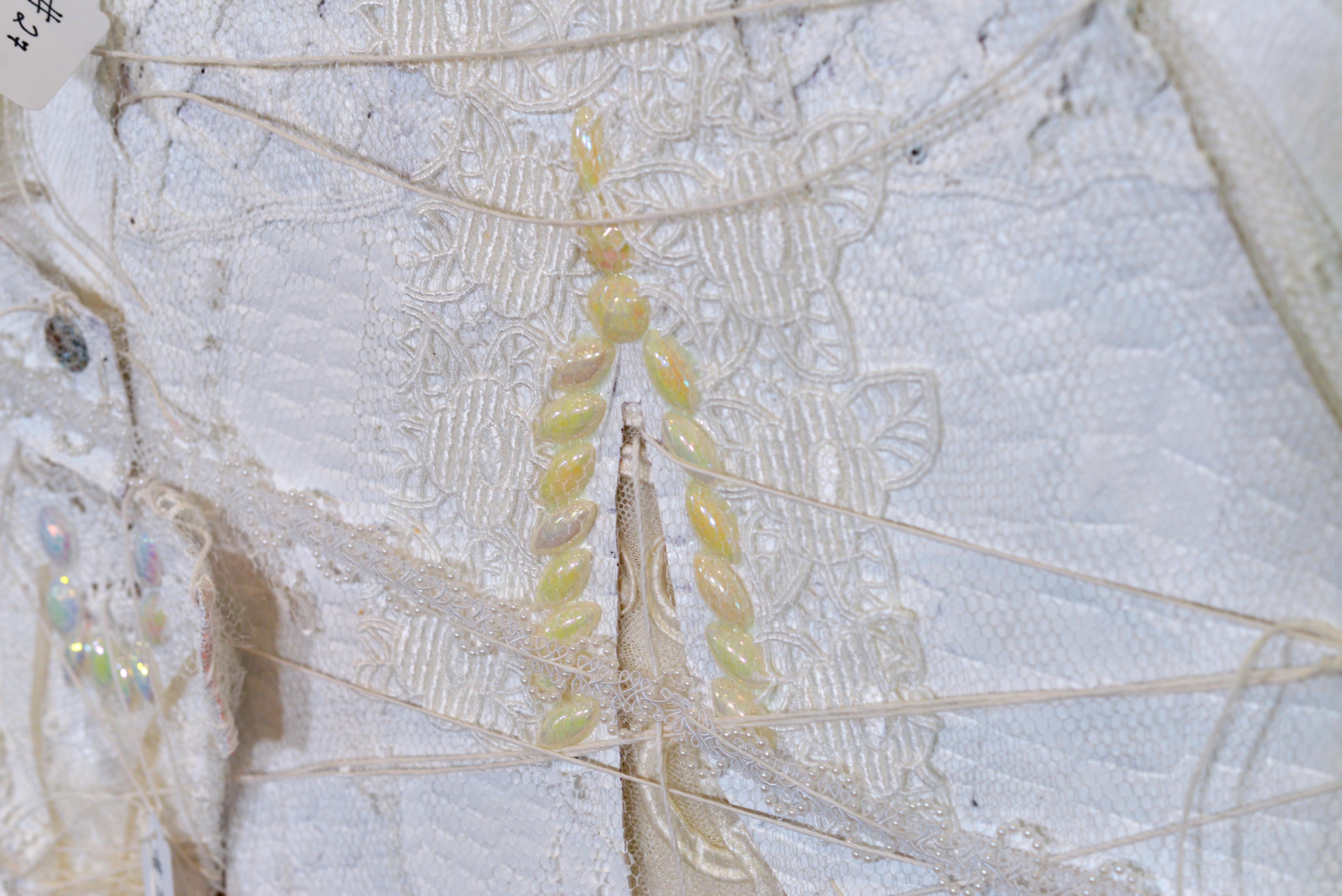 Remnants 4, Large white dress with 17 small dresses sewn on - Contemporary Mixed Media Art by Andrée Carter