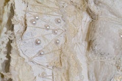 Remnants 4, Large white dress with 17 small dresses sewn on