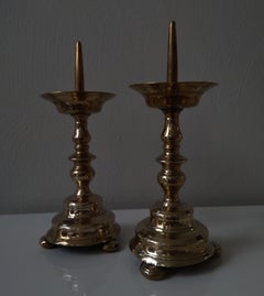 A pair of brass Baluster Pricket Candlesticks 17th Century 