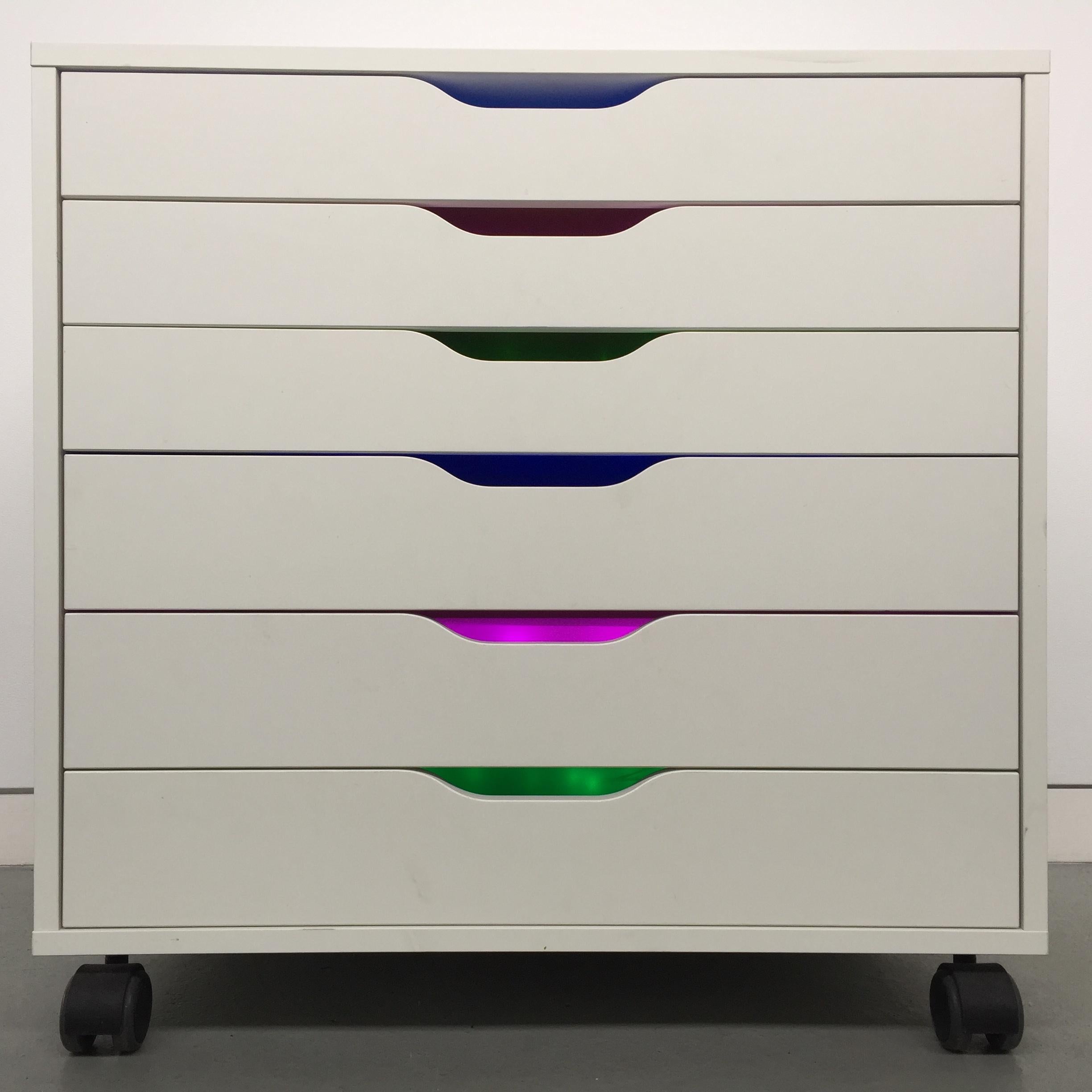 
Color Forms Cabinet: After House 5B and After Eagle Street is a site specific installation of drawings combined with theatre gels and LED lights. Deanna Lee transformed the six drawers of ODETTA's readymade flat file cabinet into a site specific