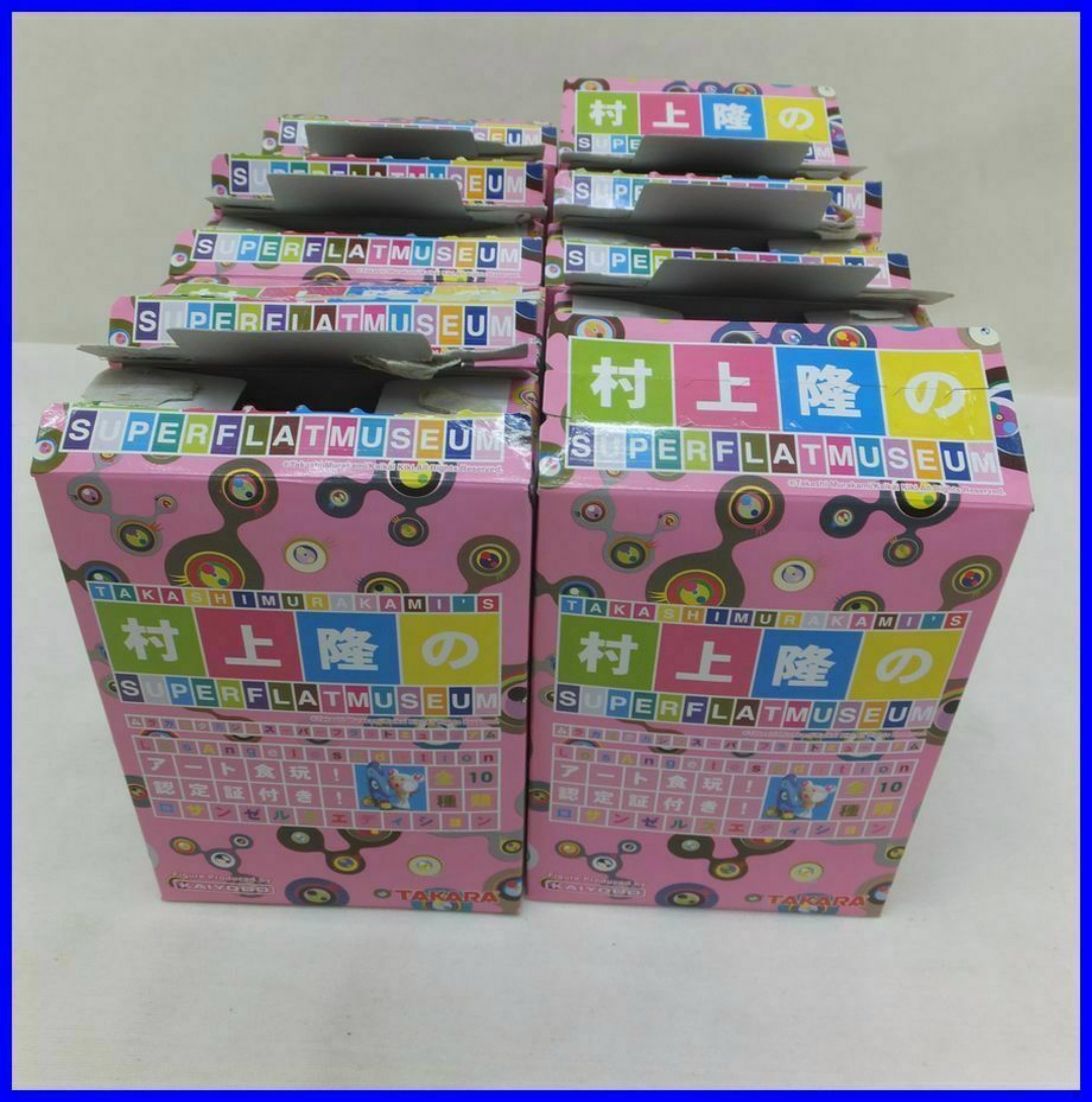 Takashi Murakami
Super Flat Museum Toys (Ten Separate Works in Pink Boxes), 2003
10 separate Plastic toys wrapped in cellophane in original pink card board boxes
5 × 3 1/2 × 1 1/2 inches
Unframed
Printed manufacturer's mark on the boxes. Each work