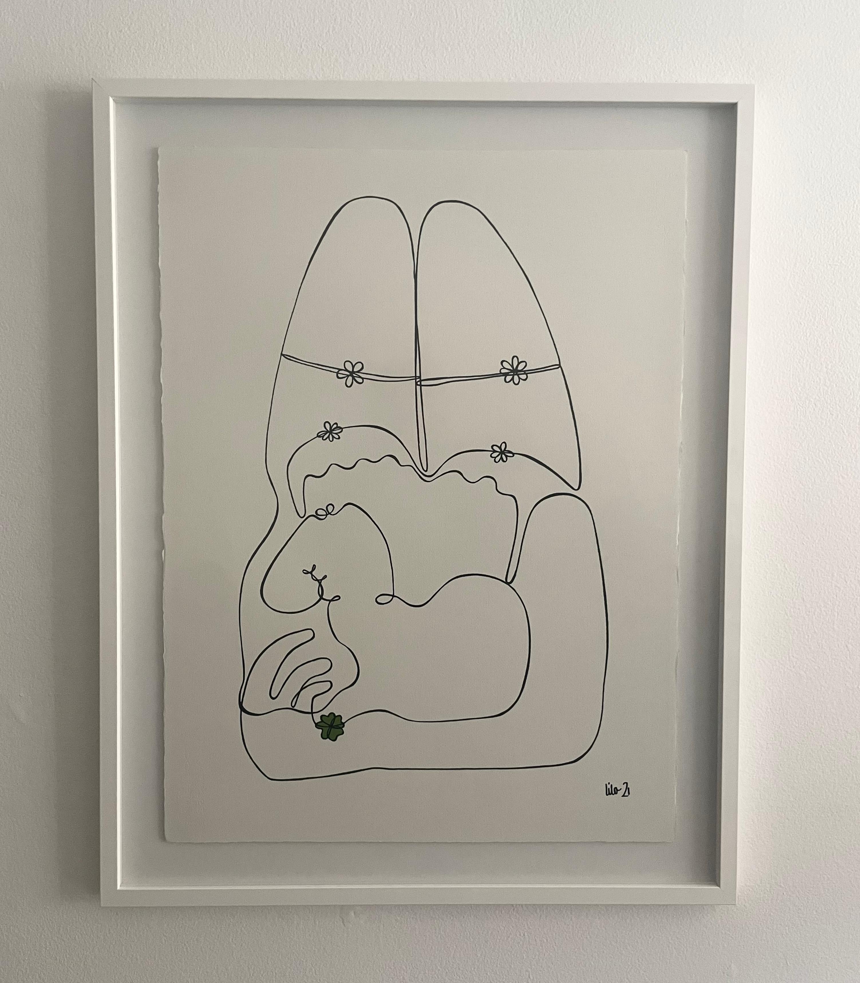 Black, white and green continuous line drawing on 100% cotton paper. 
Woman lying down holding a four clover in her hand.  
Framed in custom white lacquered frame with museum glass.