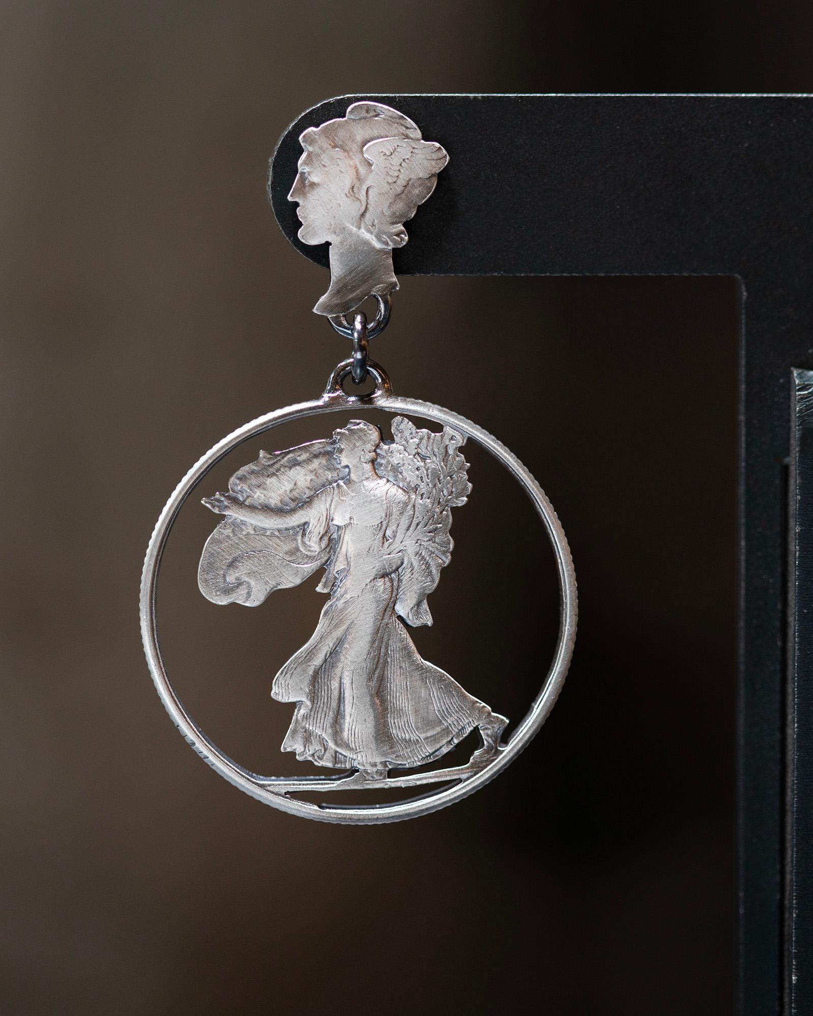 The Walking Liberty Drops are hand sawn coin earrings made from silver Liberty or Mercury dimes (on top) minted in the US from 1916-45 and the front and the back of the same coin on bottom (my favorite coin) - the Walking Liberty half dollar minted