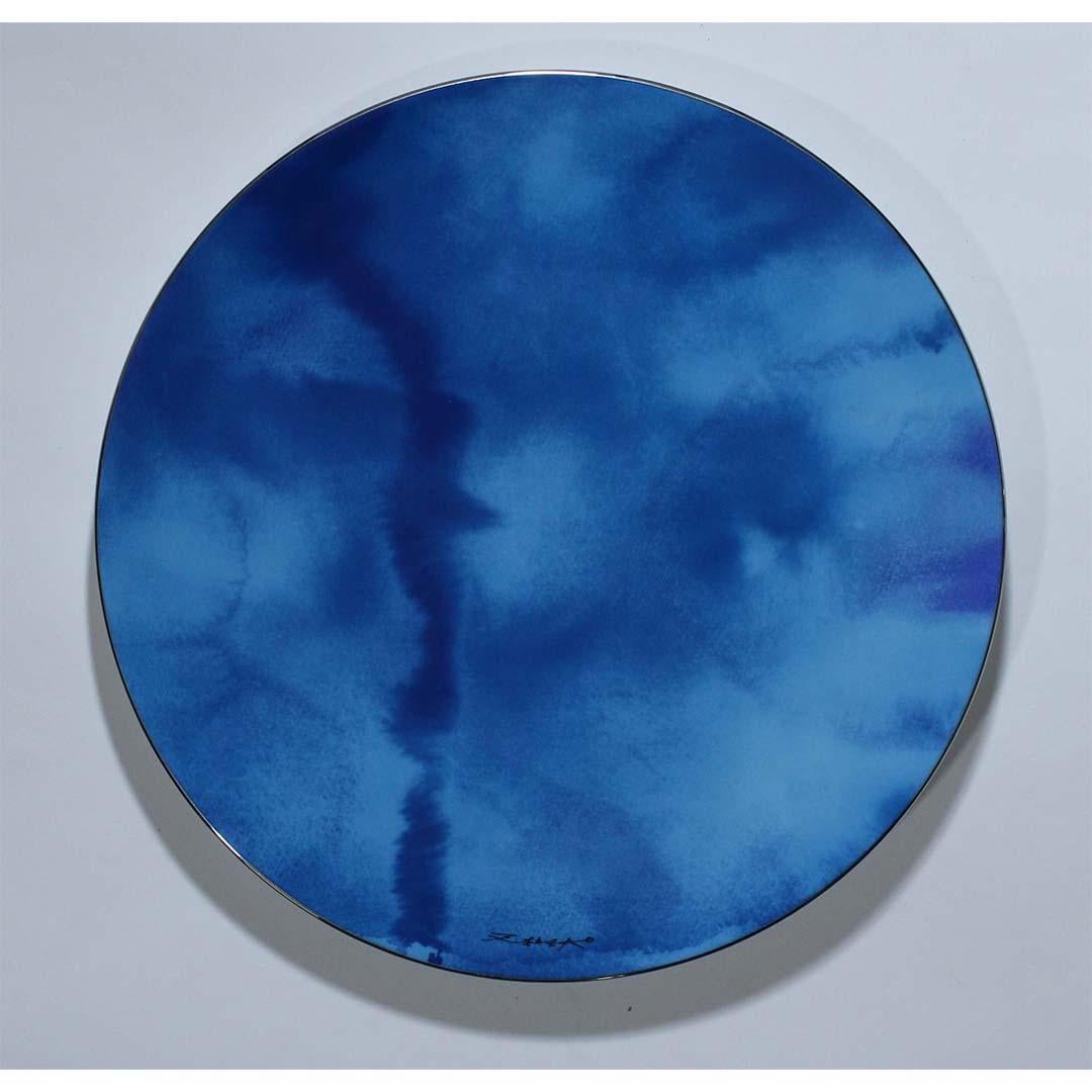 In the realm of artistic alchemy, Zao Wou-Ki's limited edition plate, "Pierre de Ciel," crafted by Bernardaud, unfolds as a poetic composition in Limoges porcelain—a masterpiece that transcends the ordinary.

This numbered piece, marked as 92 out of