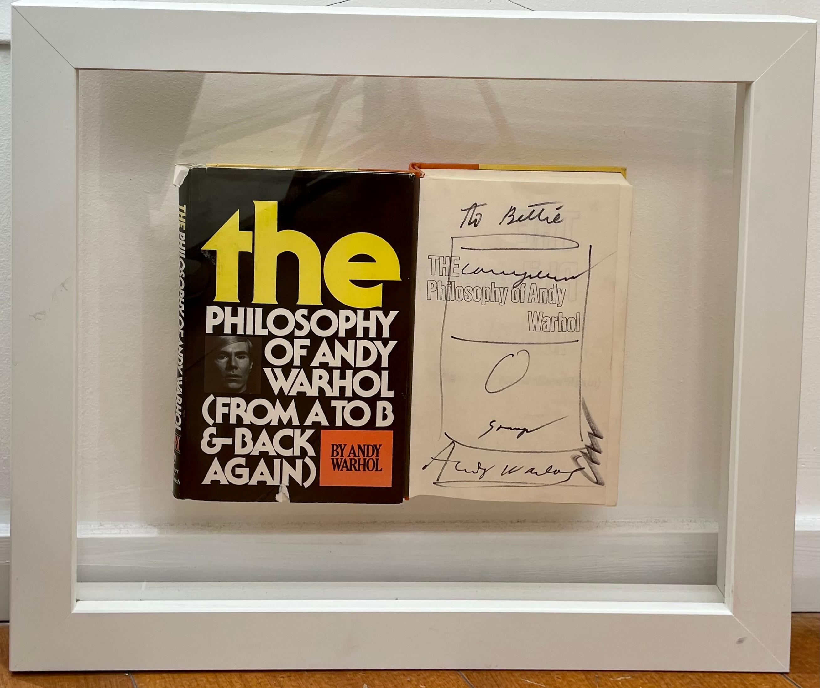 Un livre d'Andy Warhol. Signé et esquissé par l'artiste sur la première page du livre.
Signé au bas de la première page.

La philosophie d'Andy Warhol (de A à B et inversement) 
Écrit par Andy Warhol. 
Publié par Harcourt Brace Jovanovich, 1975