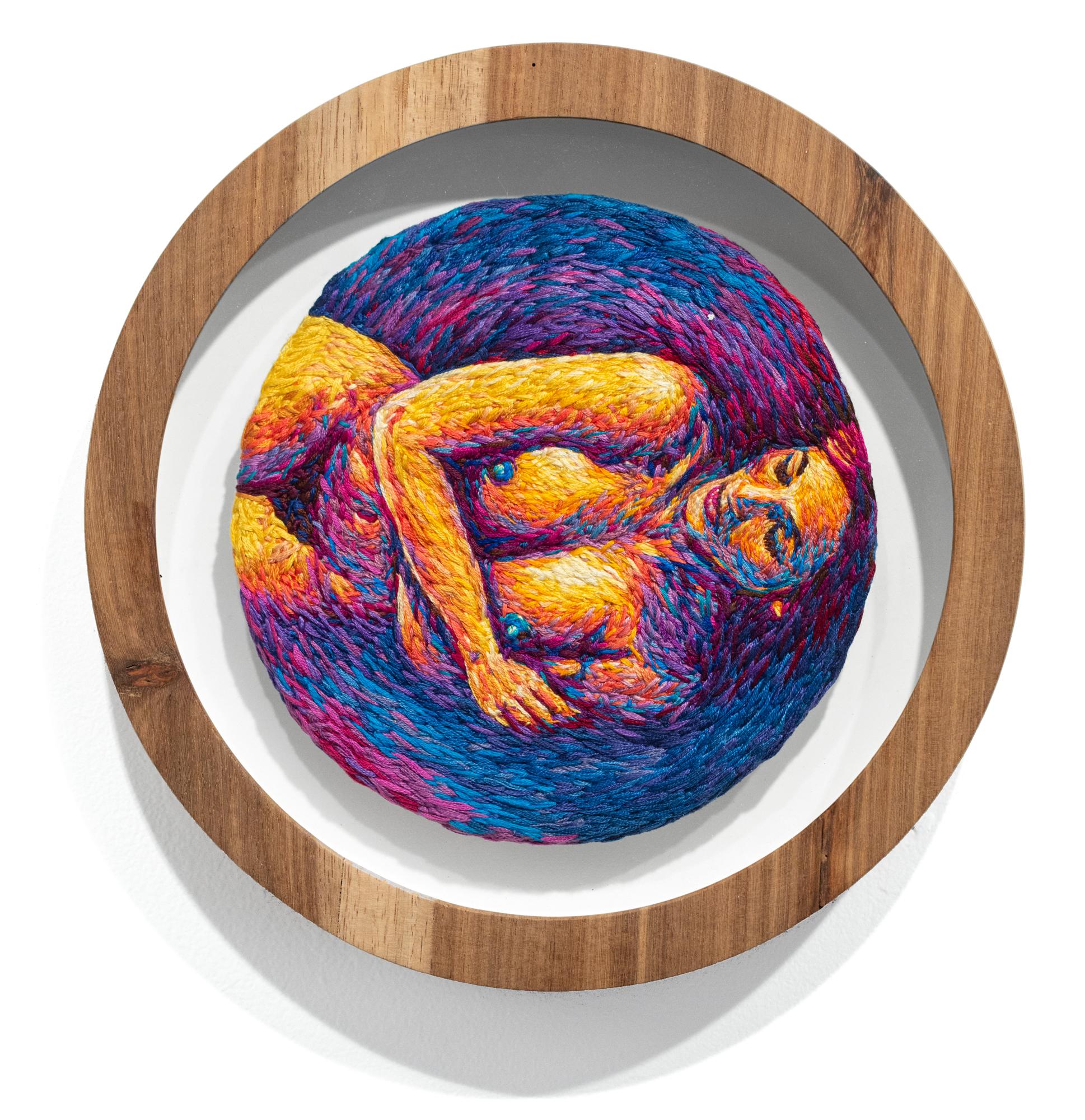 Referenced from an Australian 1983 Playboy, this is Faith Shaunessy embroidered by Danielle Clough in her signature, colorful style.  This piece is custom-framed in a classic, wood, round frame measuring 10 inches in diameter.

