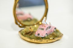 "Tantalize, Synchronize, Exercise!", paesaggio di compatte e specchi in miniatura