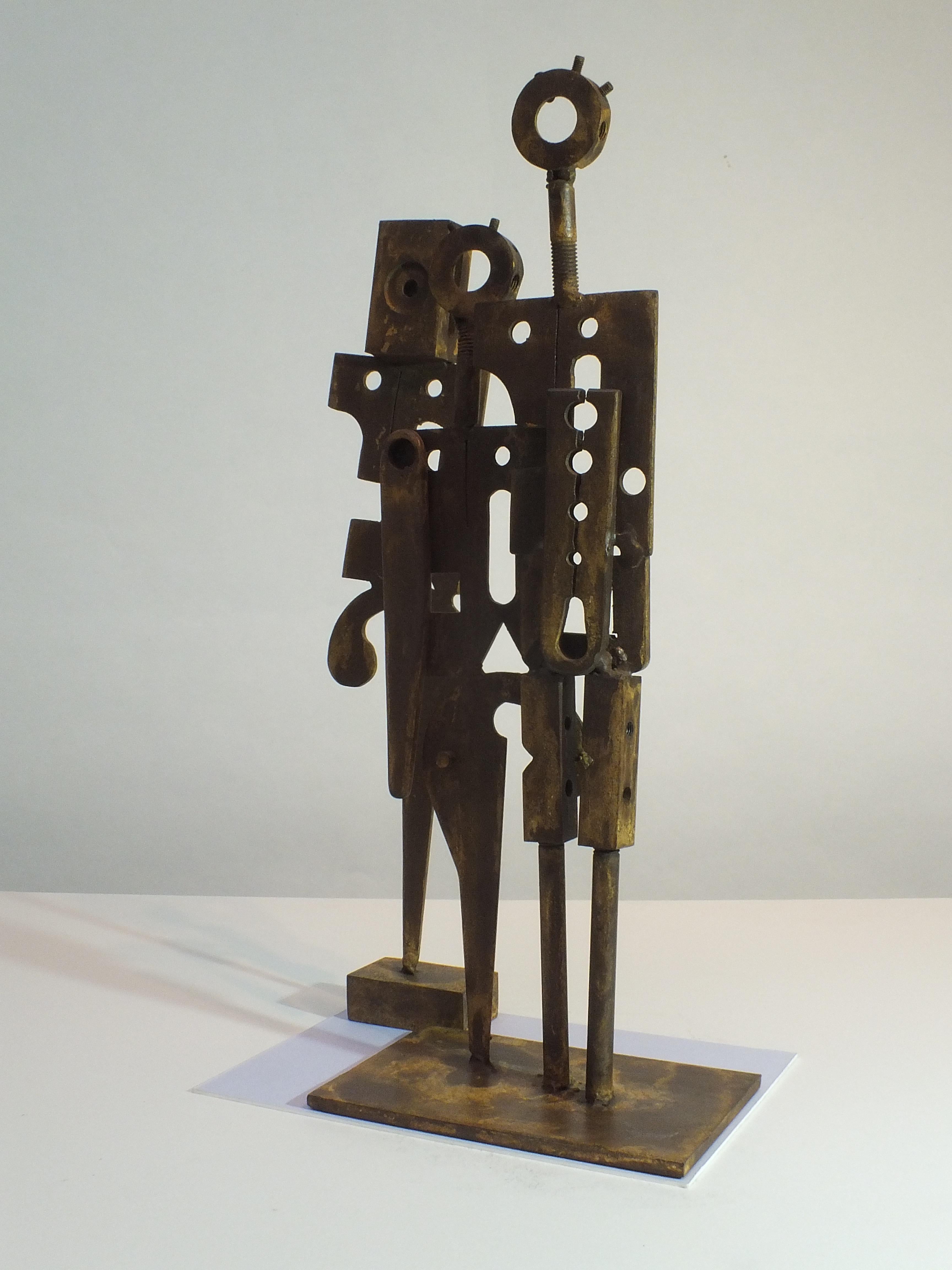 This 2 piece solid steel sculpture is a far more industrial, angular work from Rawlins. Perhaps looking at how people have evolved from earlier more simple eras into today's era of the machine and our reliance on them. However, the piece is not a