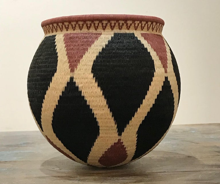 Unknown Black, cream and rose colored basket, Wounaan tribe, Panama