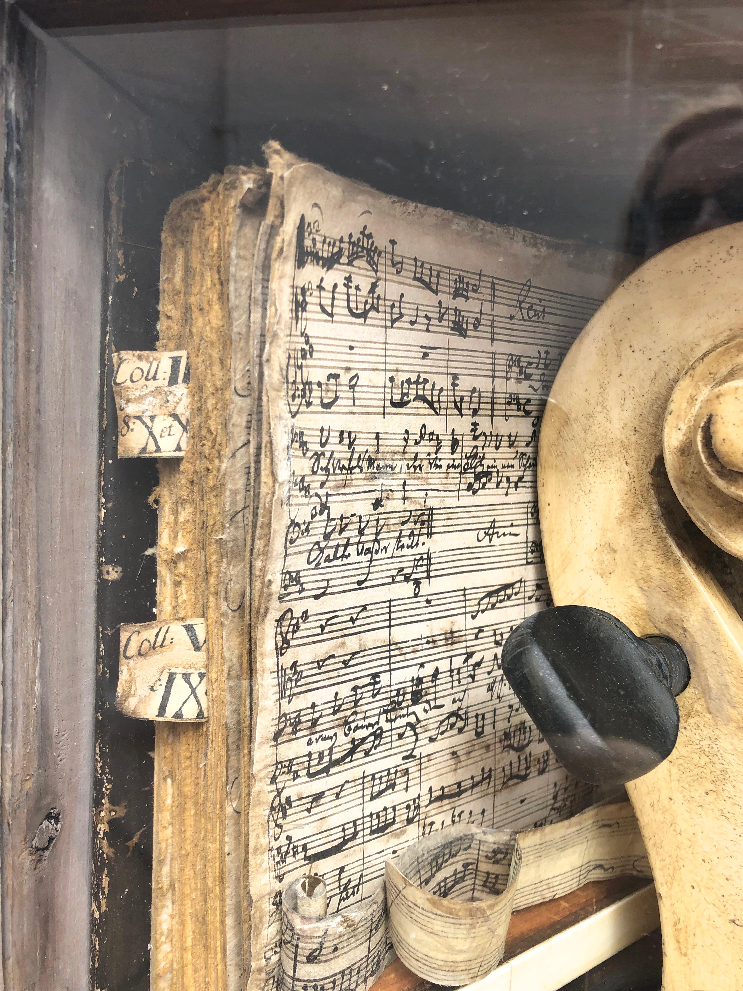 Musick Construction,  3d wall sculpture.
3D Construction/Assemblage, Mixed Media, wood, mixed media, 2019   Erikson often abandons the found object to create his own inventory of custom-made objects and fragments. Here the music manuscript, the