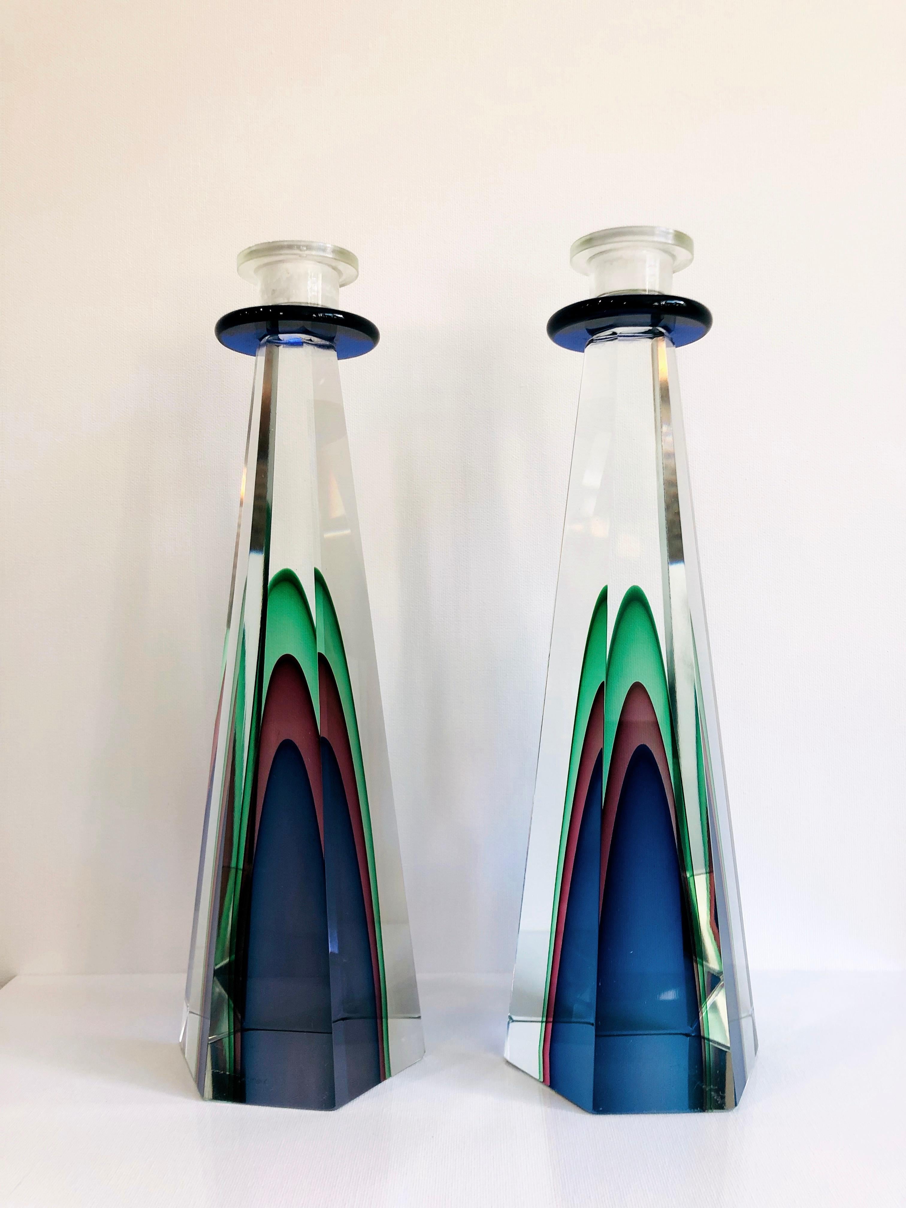 Pair of Luigi Onesto Murano Glass Candlestick 
Each signed..
Luigi Onesto was born in Murano into a glass-making family.
At the age of 15, he begins to learn the secrets of glass as an apprentice at Gambaro & Poggi, one of the oldest and most famous