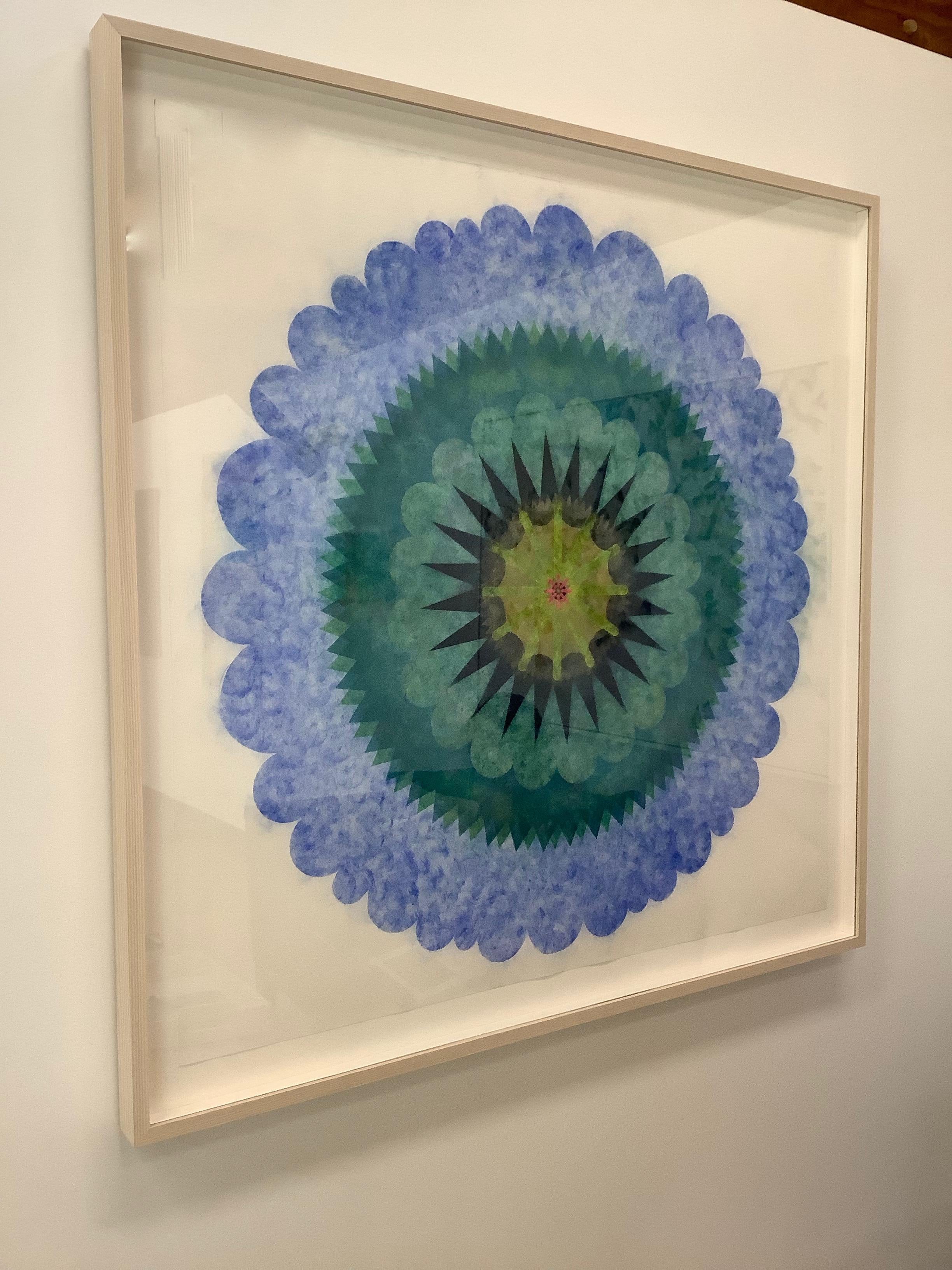 This multicolored drawing has a beautiful, soft mottled texture created with Judge's unique powered pigment technique. Blue Opus Series 8 is a predominately blue mandala shape with a golden yellow, black, red and green  center creating an