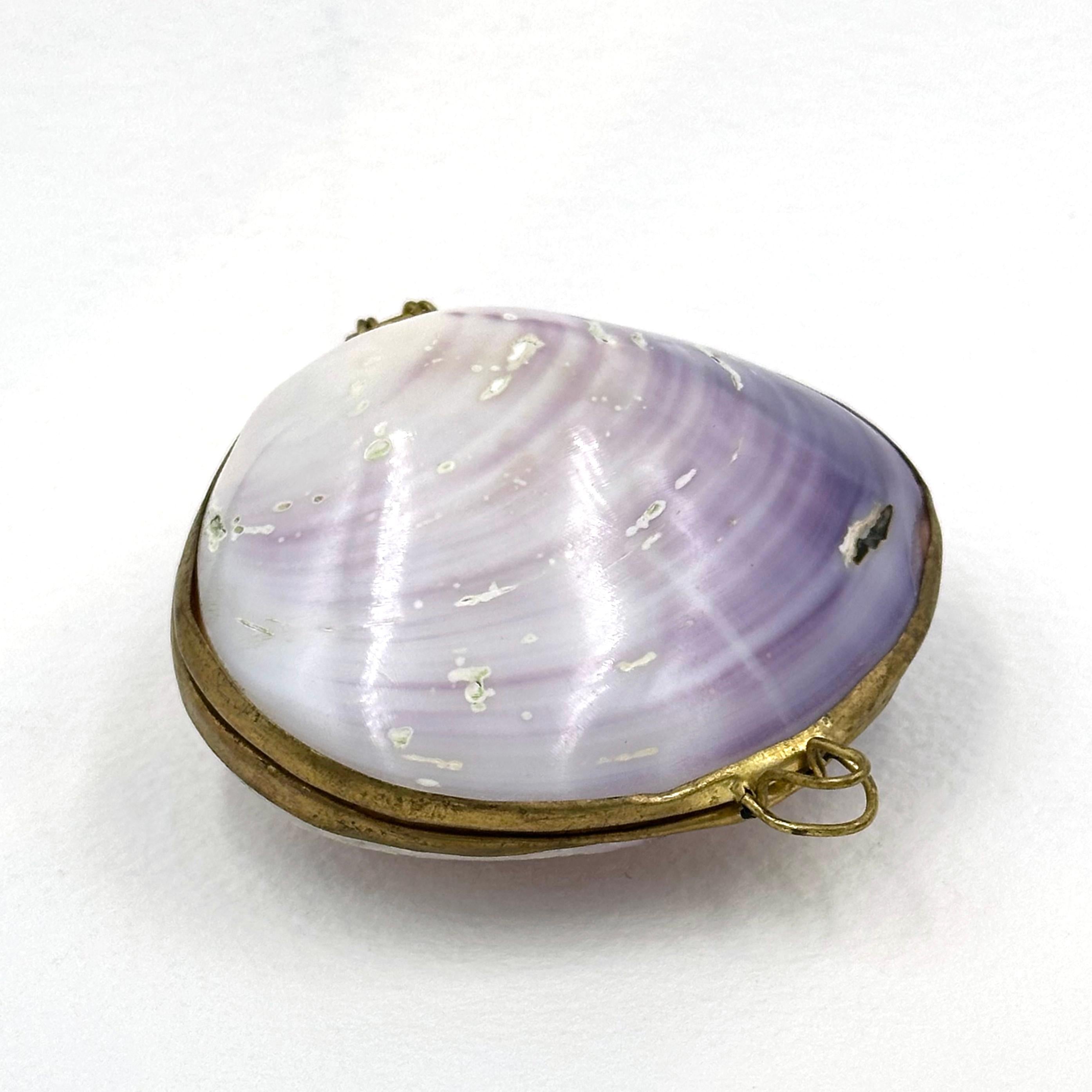 Clamshell Compact

Early 20th century
Clam, gold clasp/interior plating

