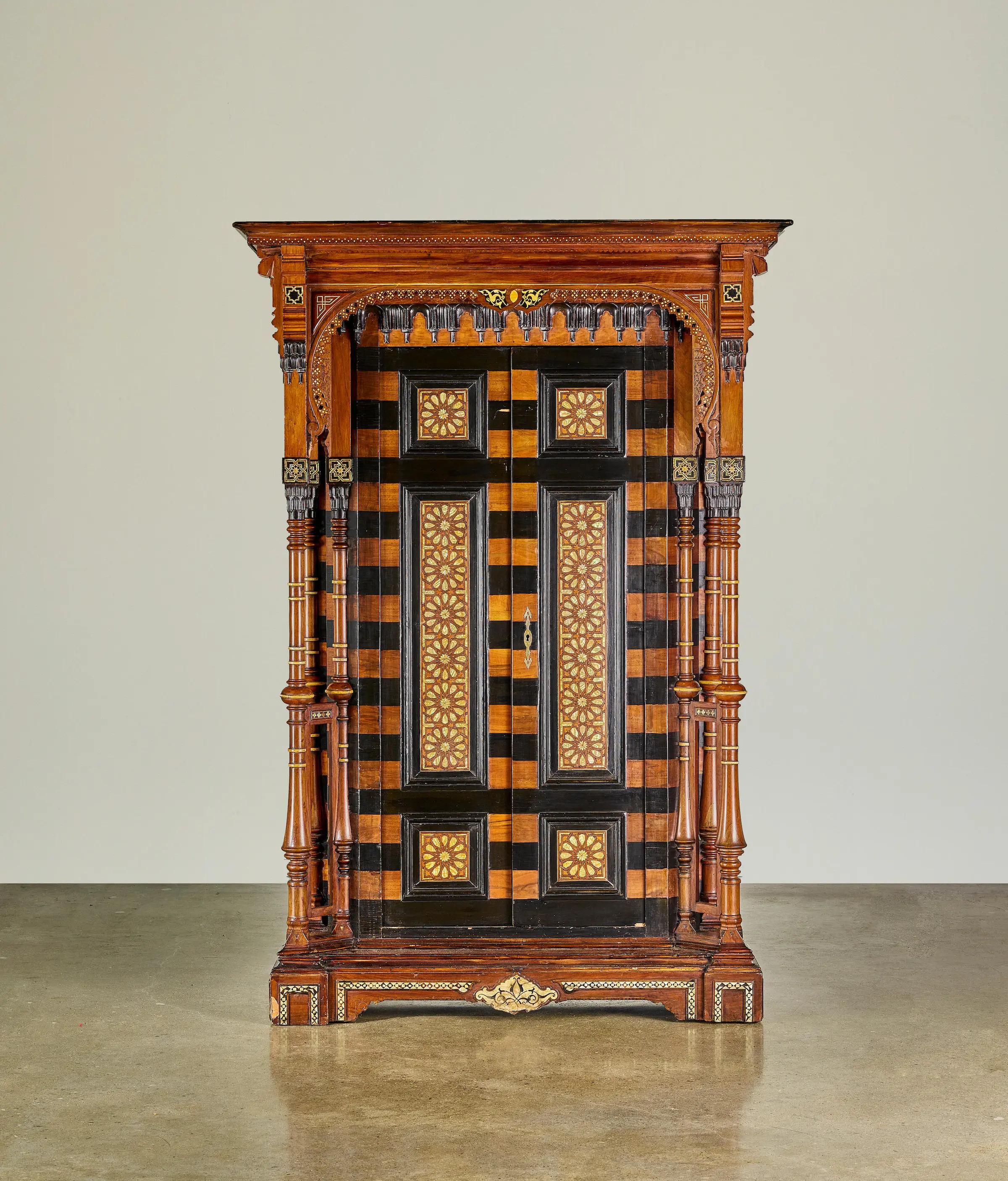 A Levantine Style Simulated Bone and Shell Inlaid Armoire
20th century
height 84in (213.5cm); width 58in (147.5cm); depth 23in (59cm) 


A Levantine Style Simulated Bone and Shell Inlaid Armoire
20th century
height 84in (213.5cm); width 58in