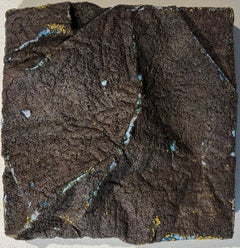 Art and fashion, black dark brown shirt with blue pleats and texture