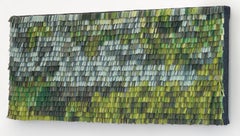 Obra de arte tejida en piel con degradado de color verde