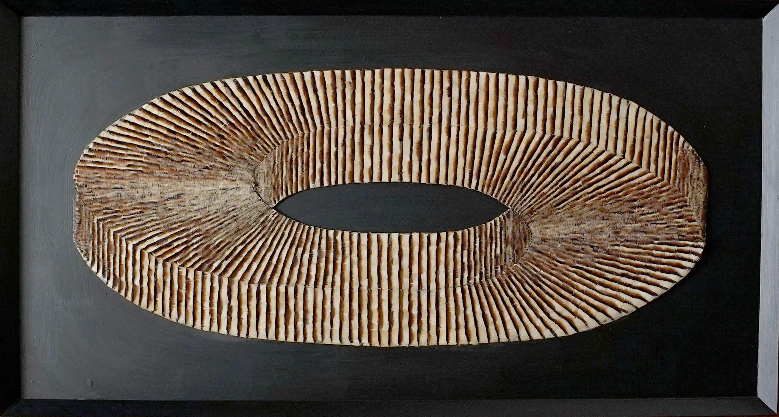 "Confubius" by Spanish artist Henar Iglesias is a rare one of a kind abstract geometric partridge feather artwork with an optical illusion quality. The technique employed in the creation of "Confubius" draws upon the Mesoamerican craftsmanship used