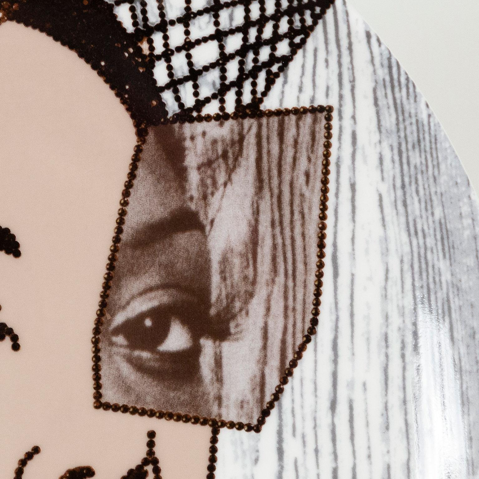 Mickalene Thomas (b.1971) is an American artist exploring the intersection of popular culture and art history, through a contemporary Black female gaze. As an openly gay Black woman, sexuality and race are essential themes in Thomas'