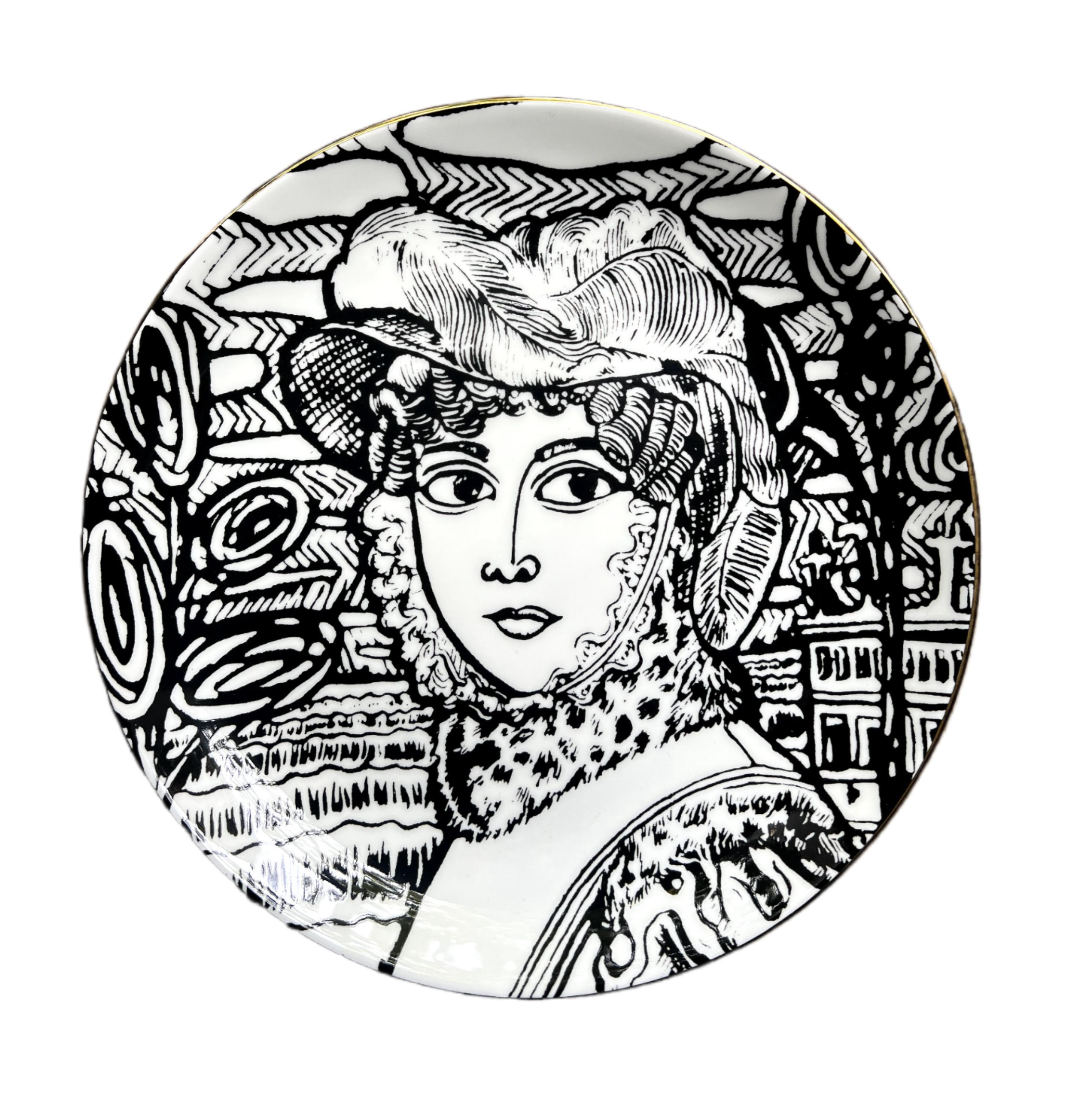 bone china with lustre rim
21 cm diameter
Grayson Perry hallmark on the back.

These decorative plates are inspired by the artwork The Great Beauty, 2024. The original piece is a cabinet heavily decorated with ceramic female portraiture, created in