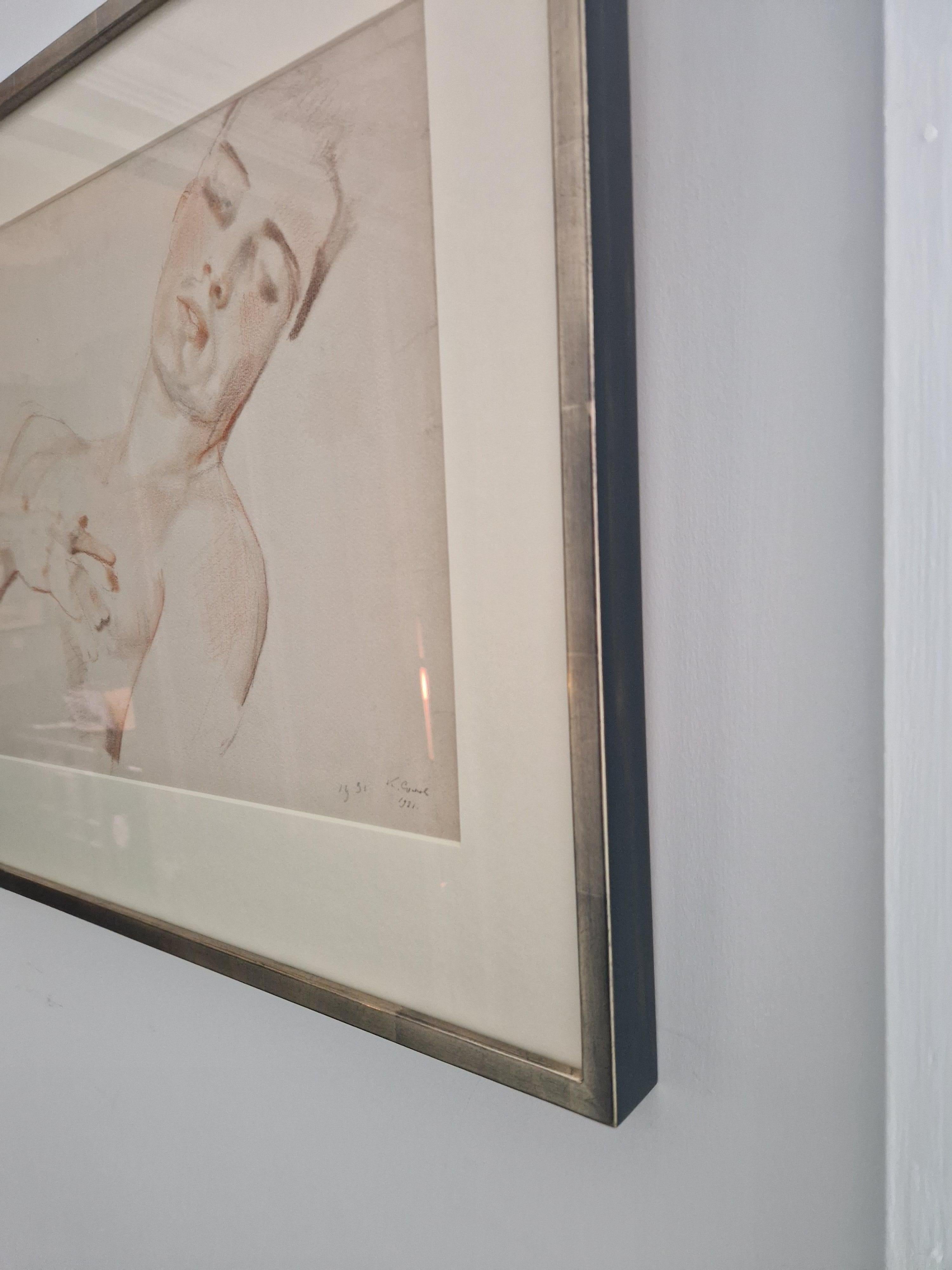 Konstantin Andreevich Somov (Russian 1869-1939), Young Man Reclining (Boris Snezhkovsky), 1931, Sanguine and pastel on paper, signed and dated (twice) (lower right), 32cm x 48cm, (46cm x 59cm framed). The frame is a hand-finished lacquered framed,