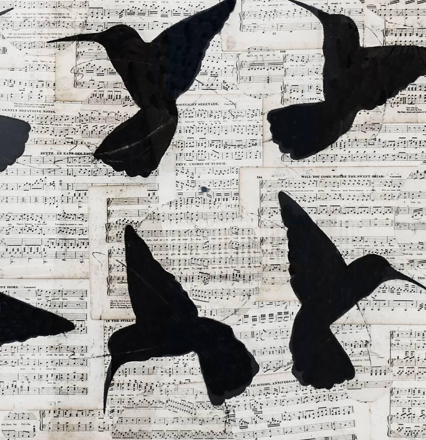 Figurative chalk drawing of flying black hummingbirds on vintage collaged music sheets by Louise Laplante
Artwork measures 36 x 32 inches
39.5 x 36 inches framed, deckle edge paper is floated in natural wood molding with glass. 

This contemporary,