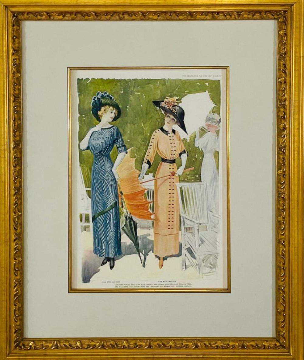 An original page of the Delineator magazine of the June 1911 issue, page 473. The page features two model ladies showing attractive Summer gowns. The vintage magazine page is finely matted in while and framed in a custom gilded and carved