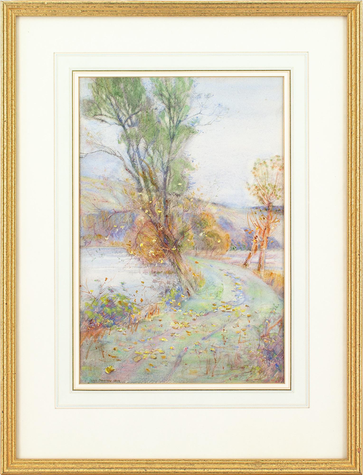 This beautiful late 19th-century watercolour by British artist Lily Bristow (1864-1935) depicts a picturesque autumnal view.

The crunch of Autumn peppers a winding track as windswept trees lean, partially bereft. Golden tones and tinted foliage