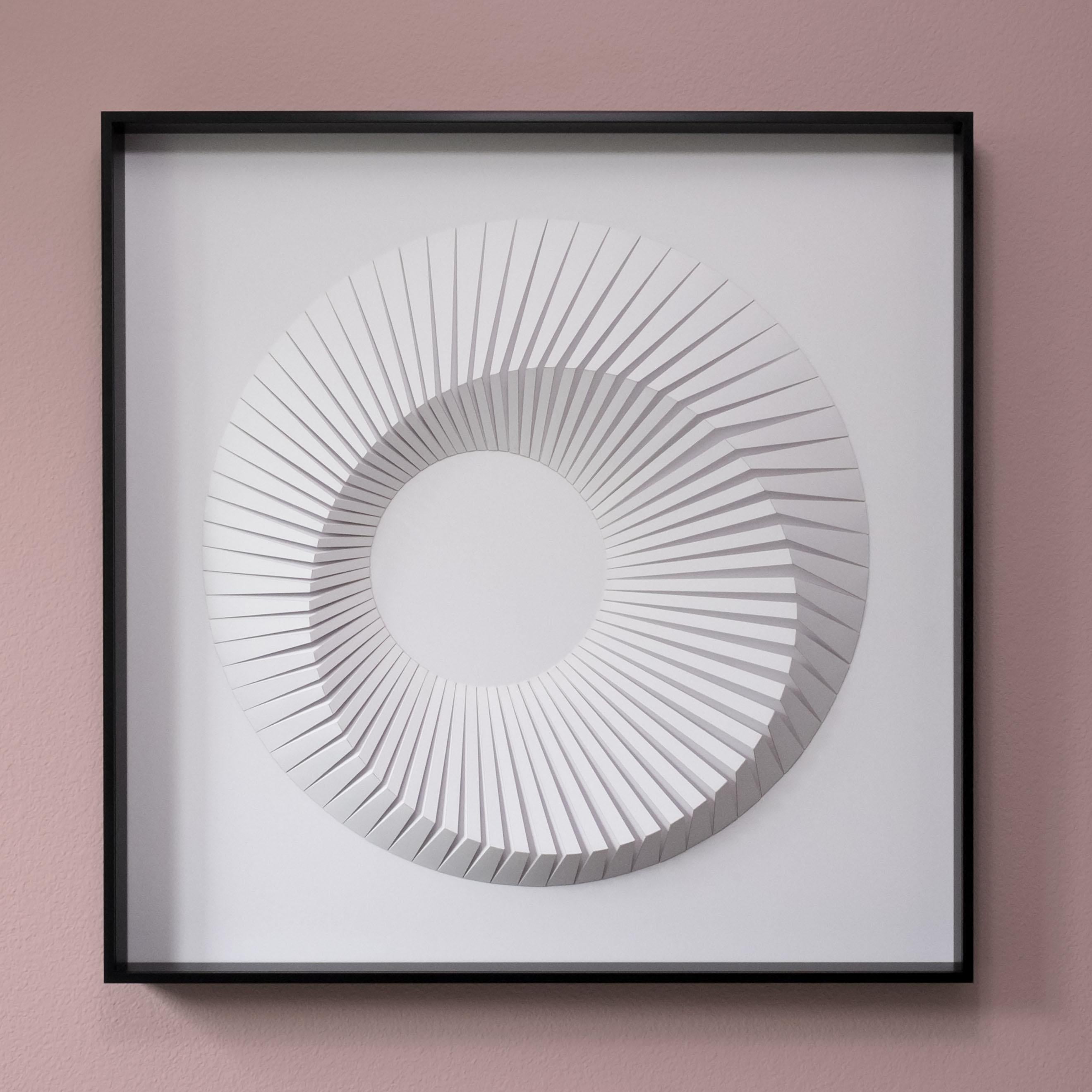This beautiful geometric abstract wall sculpture is made out of white laser cut paper that was hand folded by Yossi Ben Abu and mound on cardboard.
