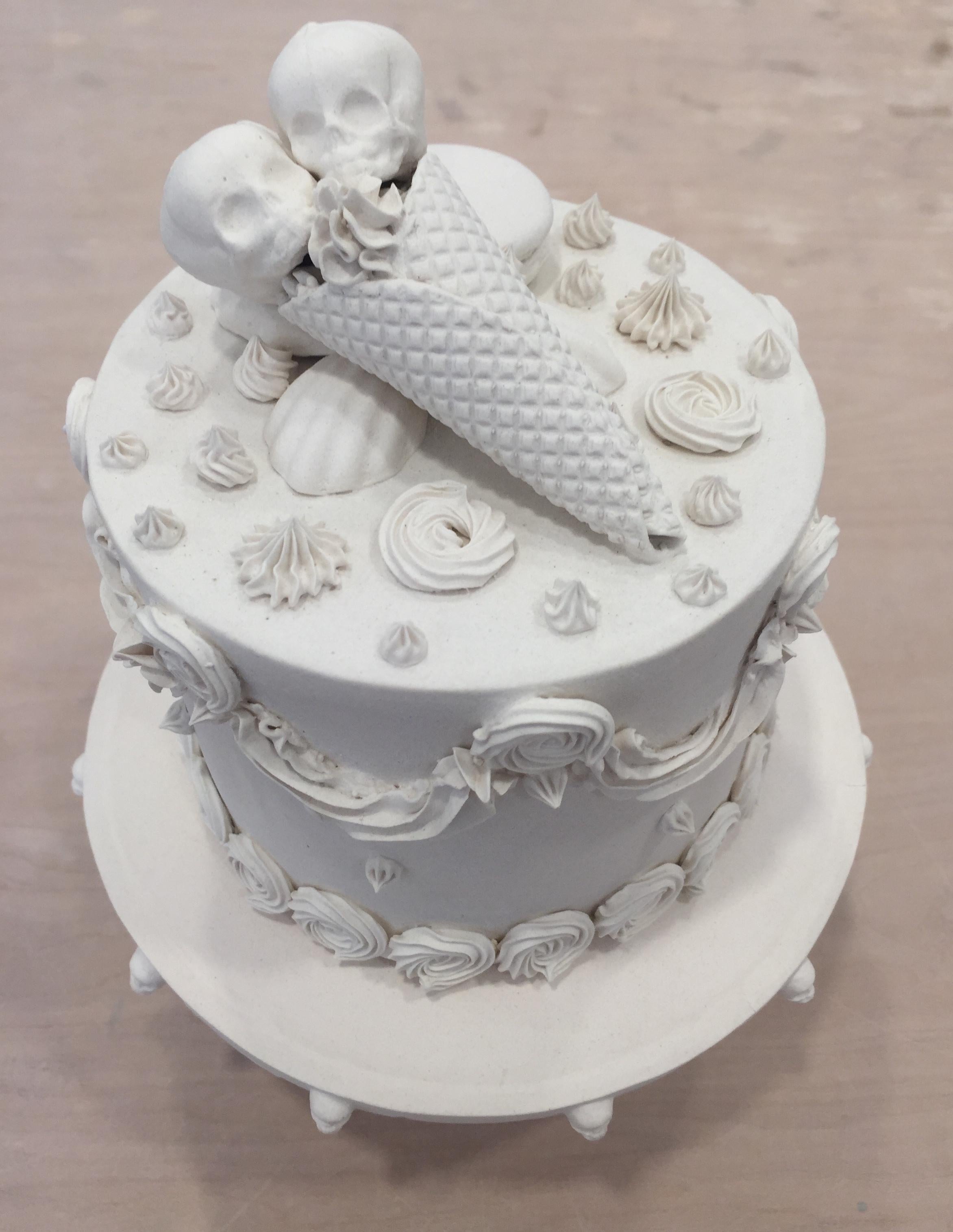 This piece consists of a porcelain slip-casted jar base, intricately topped with slip-casted fetus skulls, donut, and sweets. Decorated with hand piped details and hand rolled sprinkles. Jacqueline Tse channels her love-hate relationship with sugar