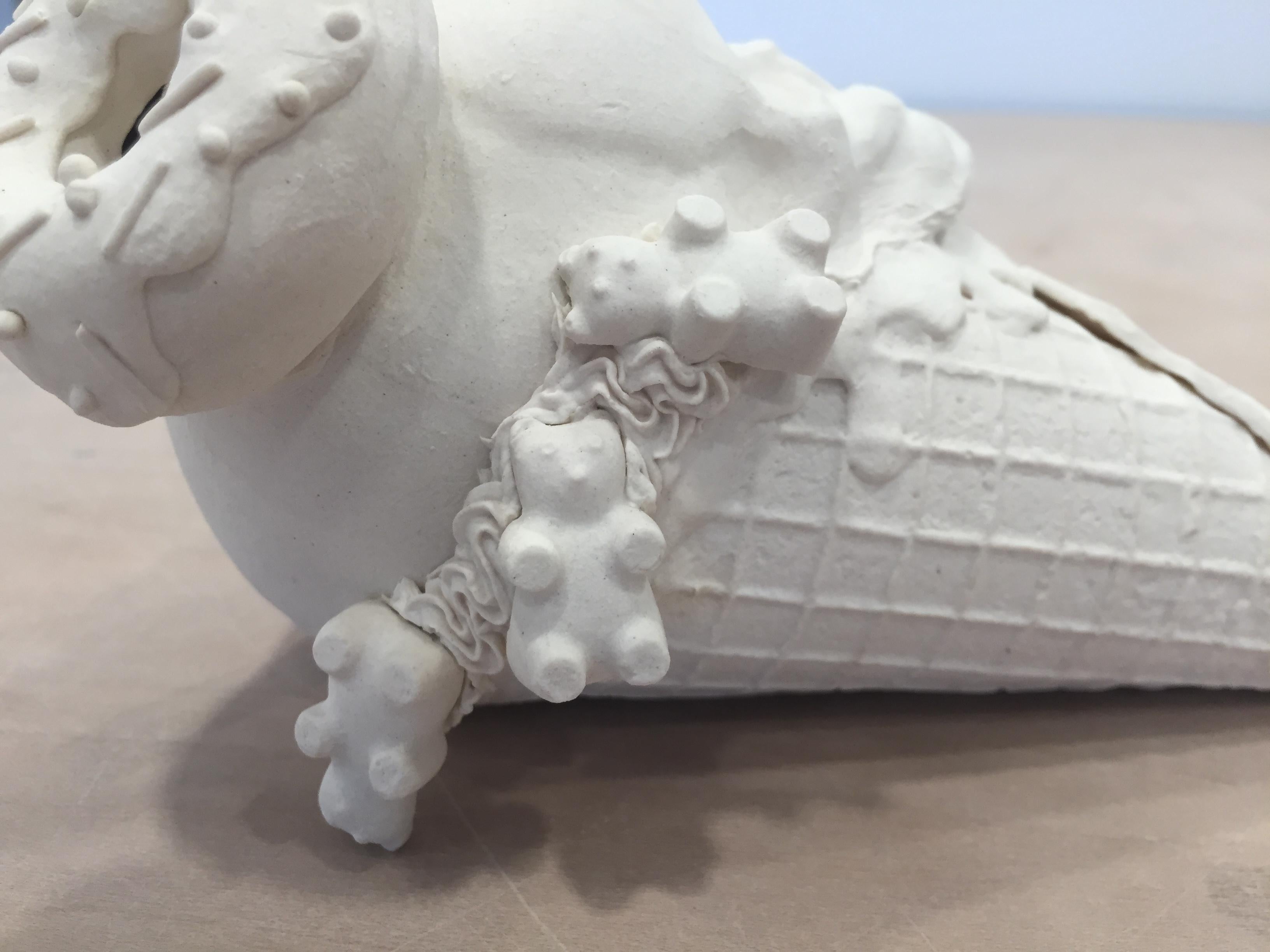 This piece consists of porcelain slip-casted and hand rolled cones, intricately topped with slip-casted fetus skulls, donut, sweets and decorated with hand piped details and hand rolled sprinkles.

Jacqueline Tse channels her love-hate relationship