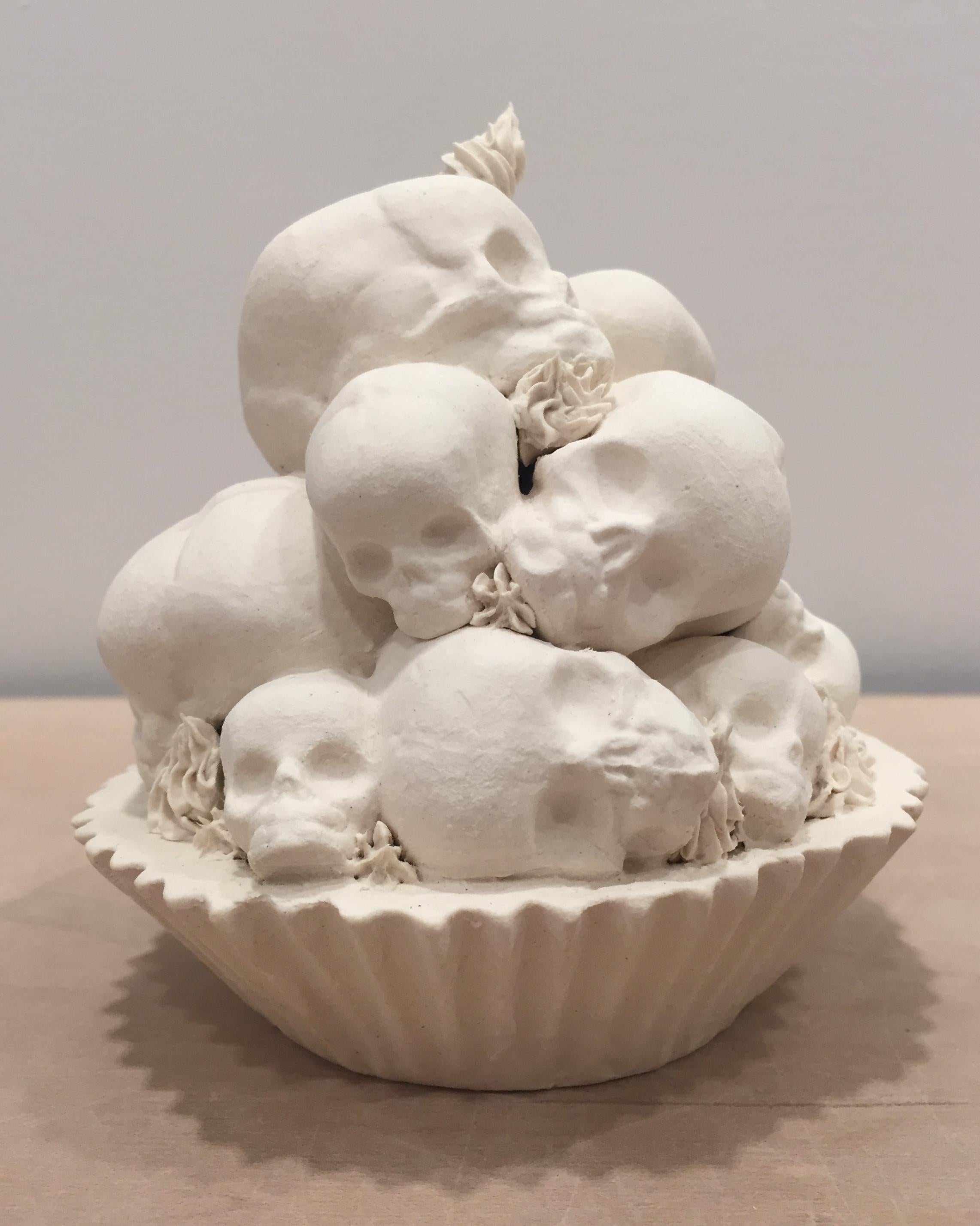 This piece consists of a porcelain slip-casted base, intricately topped with slip-casted fetus skulls, and decorated with hand piped details.

Jacqueline Tse channels her love-hate relationship with sugar into intricate porcelain sculptures of