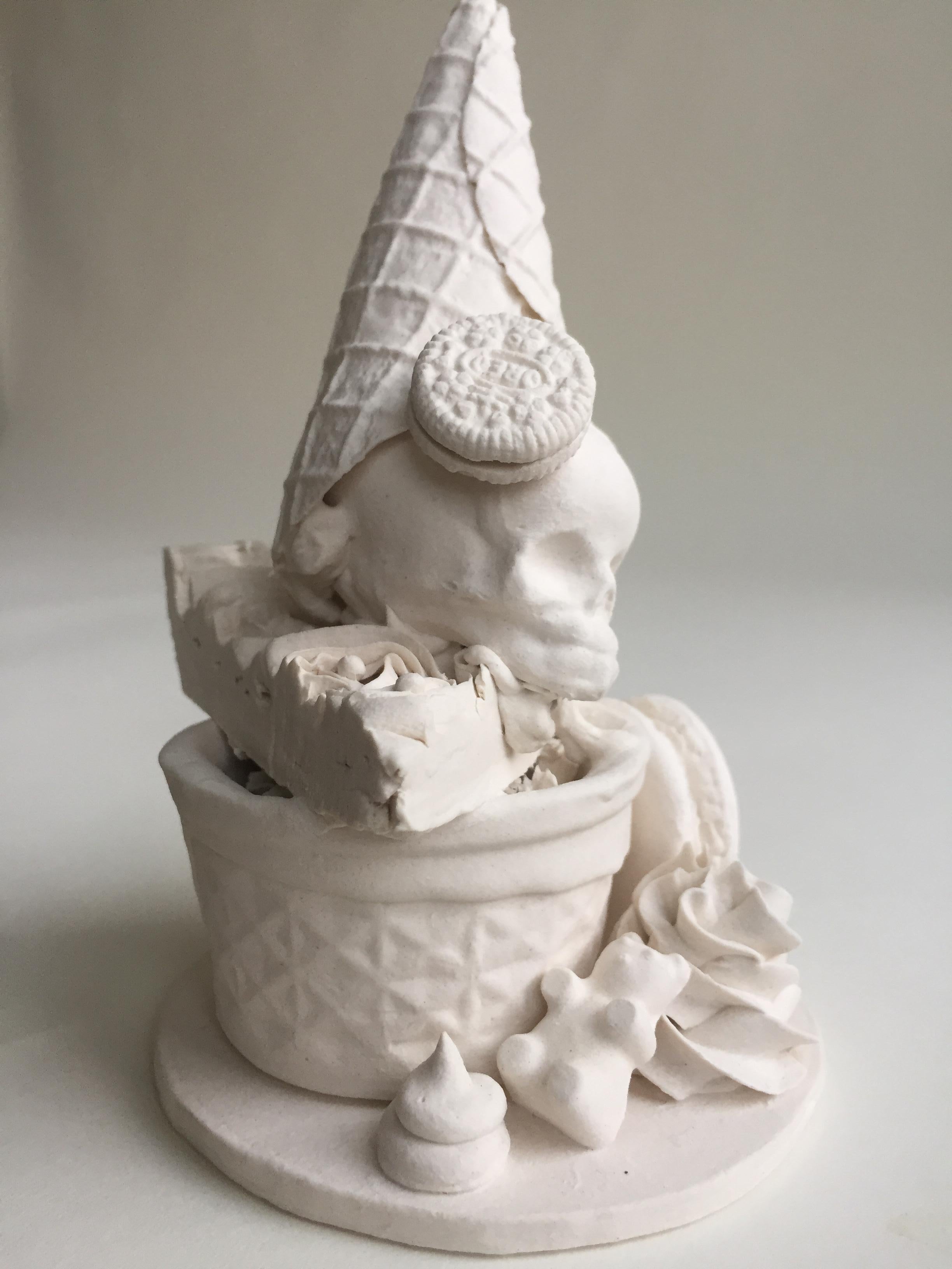 This piece consists of a porcelain slip-casted jar base, intricately topped with slip-casted fetus skulls, donut, and sweets.  Decorated with hand piped details and hand rolled sprinkles.

Jacqueline Tse channels her love-hate relationship with