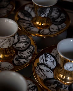 Set of 8 porcelain egg cups by Fornasetti