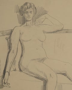 Weiblicher Akt auf einem Sofa sitzend