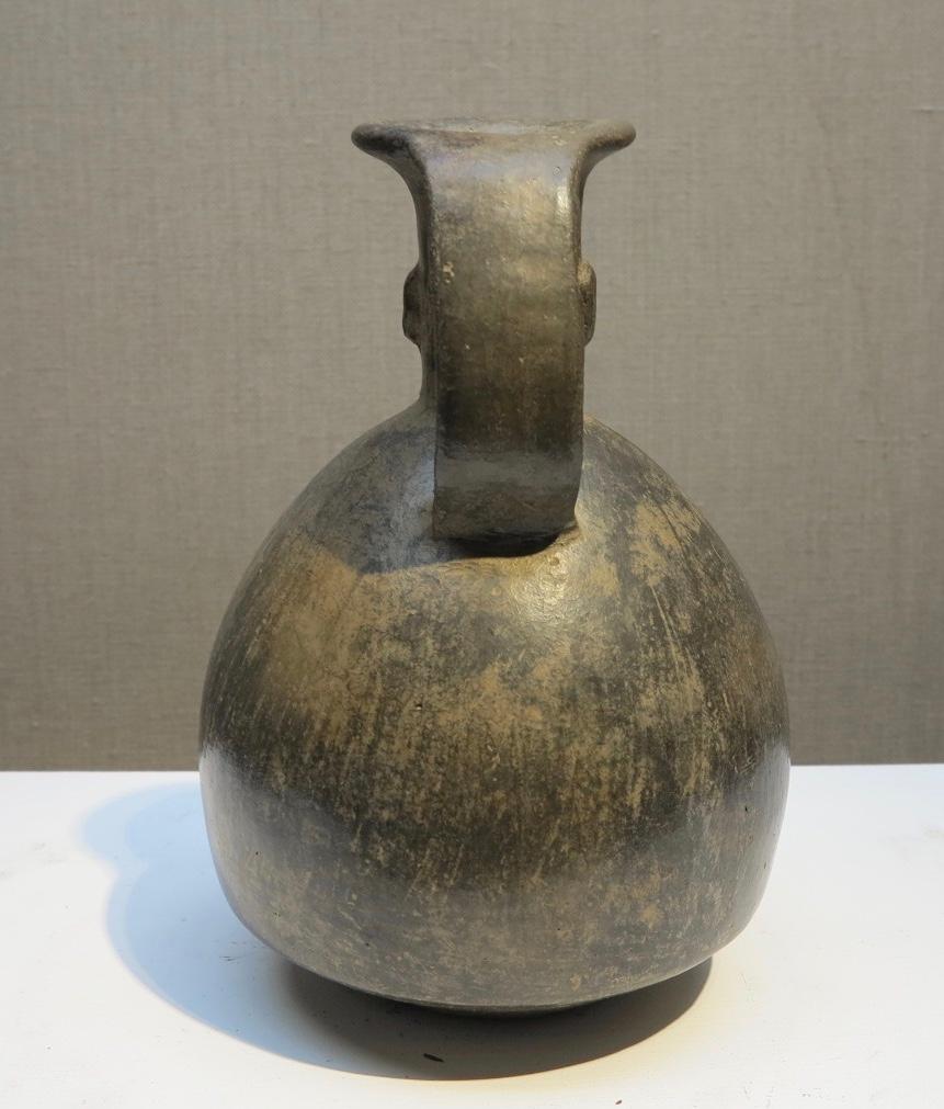 Beautiful Peruvian relief figural vessel. Chimu, circa. A.D. 1000.  Measures h. 8.75 inches, w. 5.5 inches. No damage or conservation. 