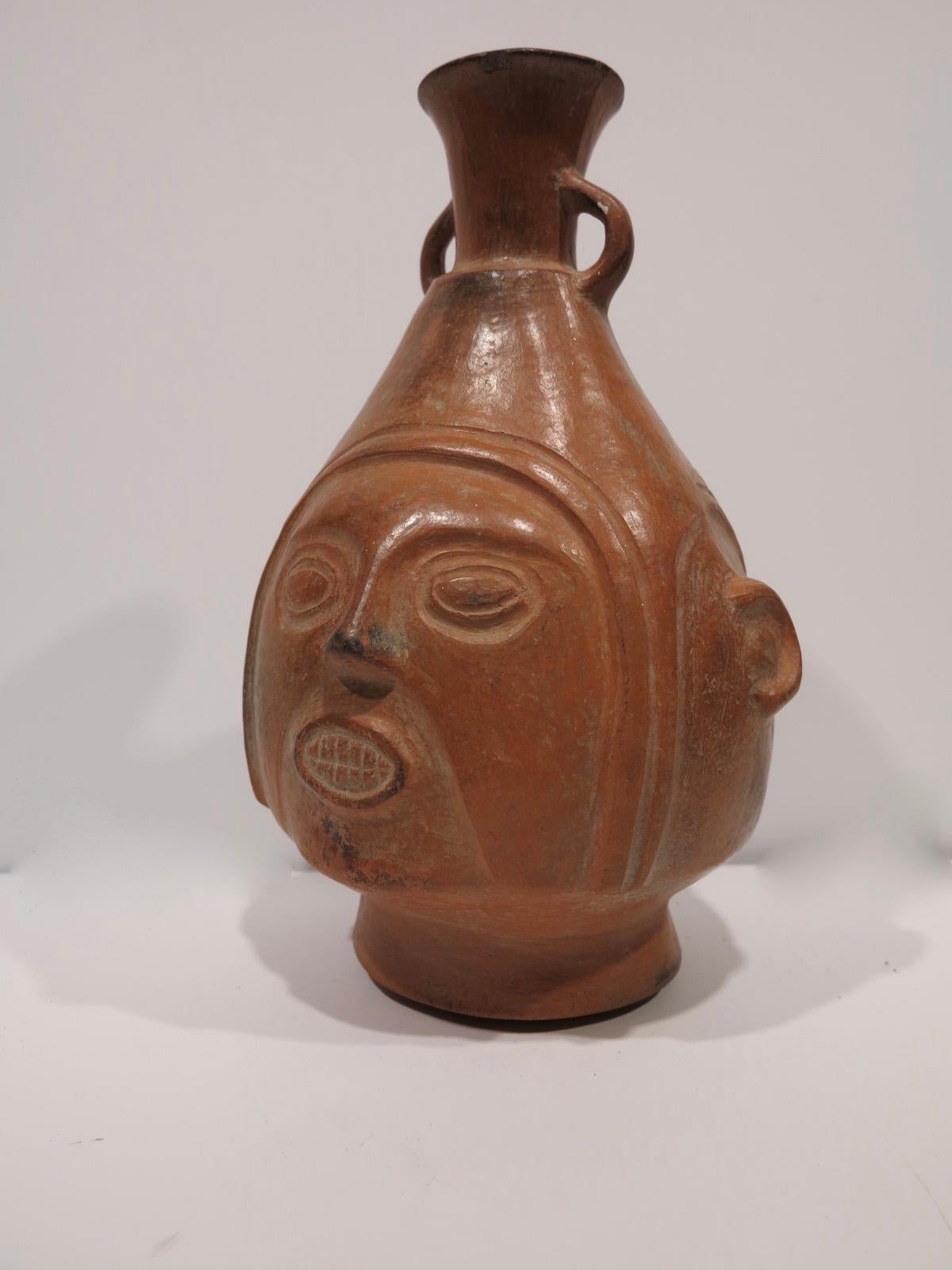 Beautiful pre-Columbian Chimu vessel. Terracotta, a.d. 1100-1400,  Peru. One very minor chip under rim of vessel opening. Otherwise outstanding condition. 