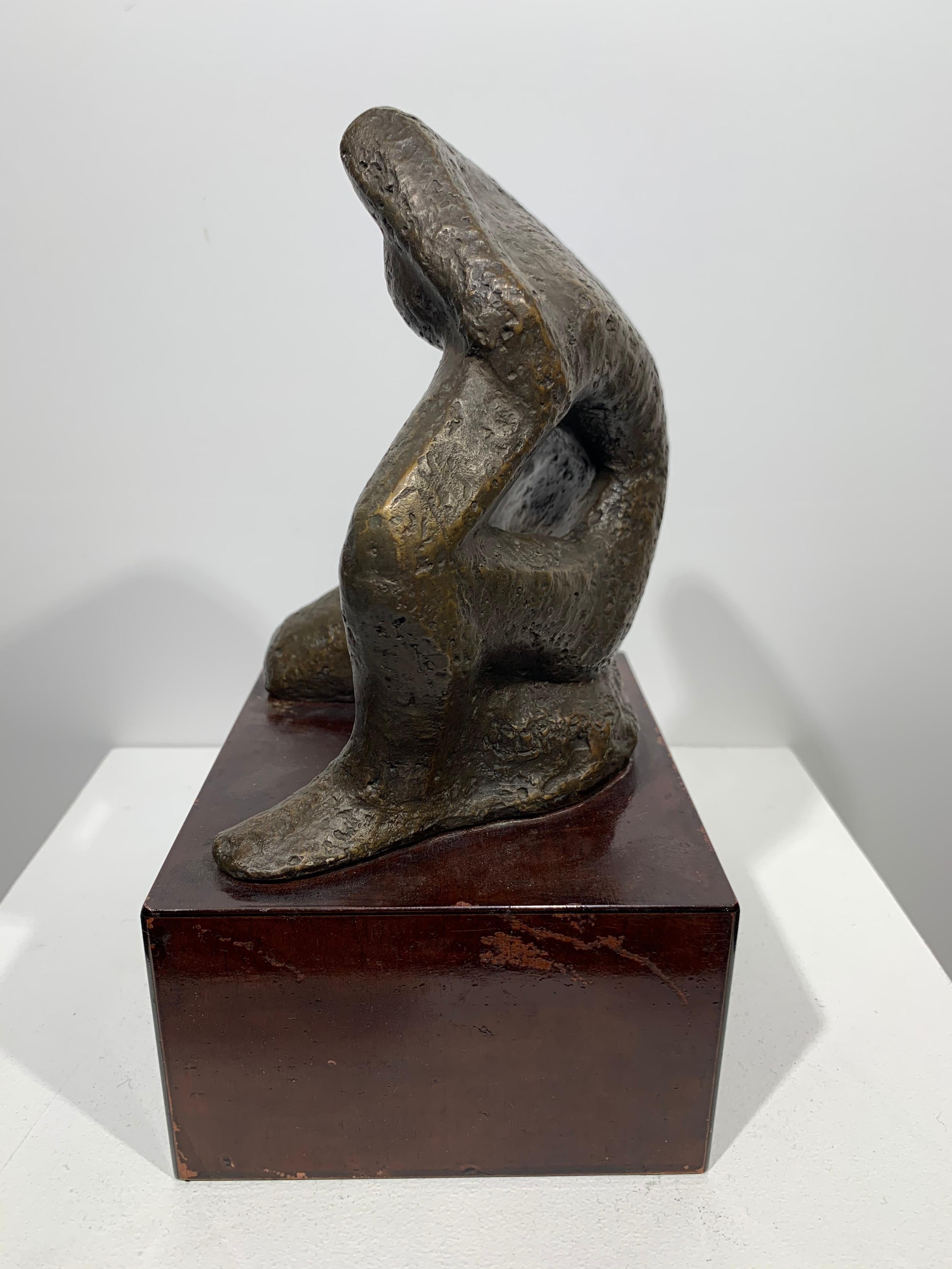 Beautiful c.1950 abstract female sculpture by American artist, Nancy Dryfoos (1919-1991). Cast bronze on mahogany wood base, casting measures 6.25