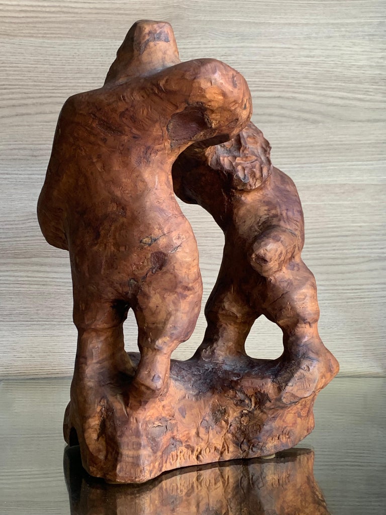 Carved wood sculpture by Israeli artist, Uri Roth (1927). Carved olive wood, measures 14 x 9 x 6 inches. Signed at base. No damage or conservation.

Uri Roth was born in Czechoslovakia and as a young boy he was interned in the infamous German death