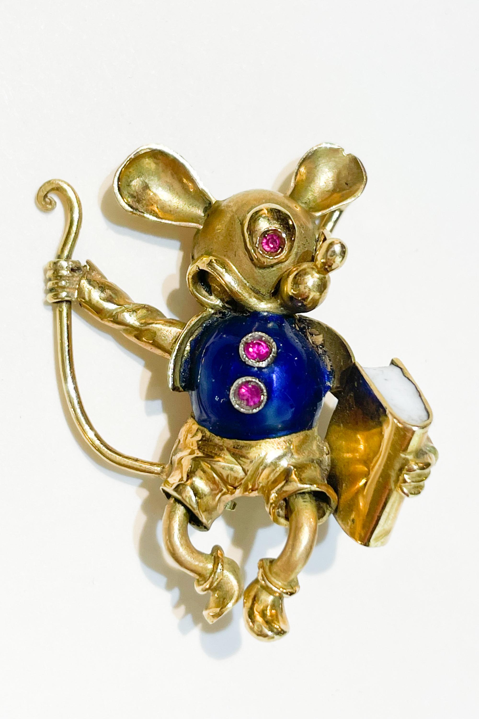 Mickey or Micky Mouse Brooch in gold and Enamels.
Mid 20th century.
Italian hallmarks: 750 , 18 ct gold.
Eyes made with red precious stones.
Fully functional closure.
High quality , detailed work.
Weight: 7gr
Size: 35mm x 27mm
Mickey Mouse is