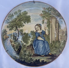 Majolica Plate by Castelli. Young woman with spindle with classical ruins.
