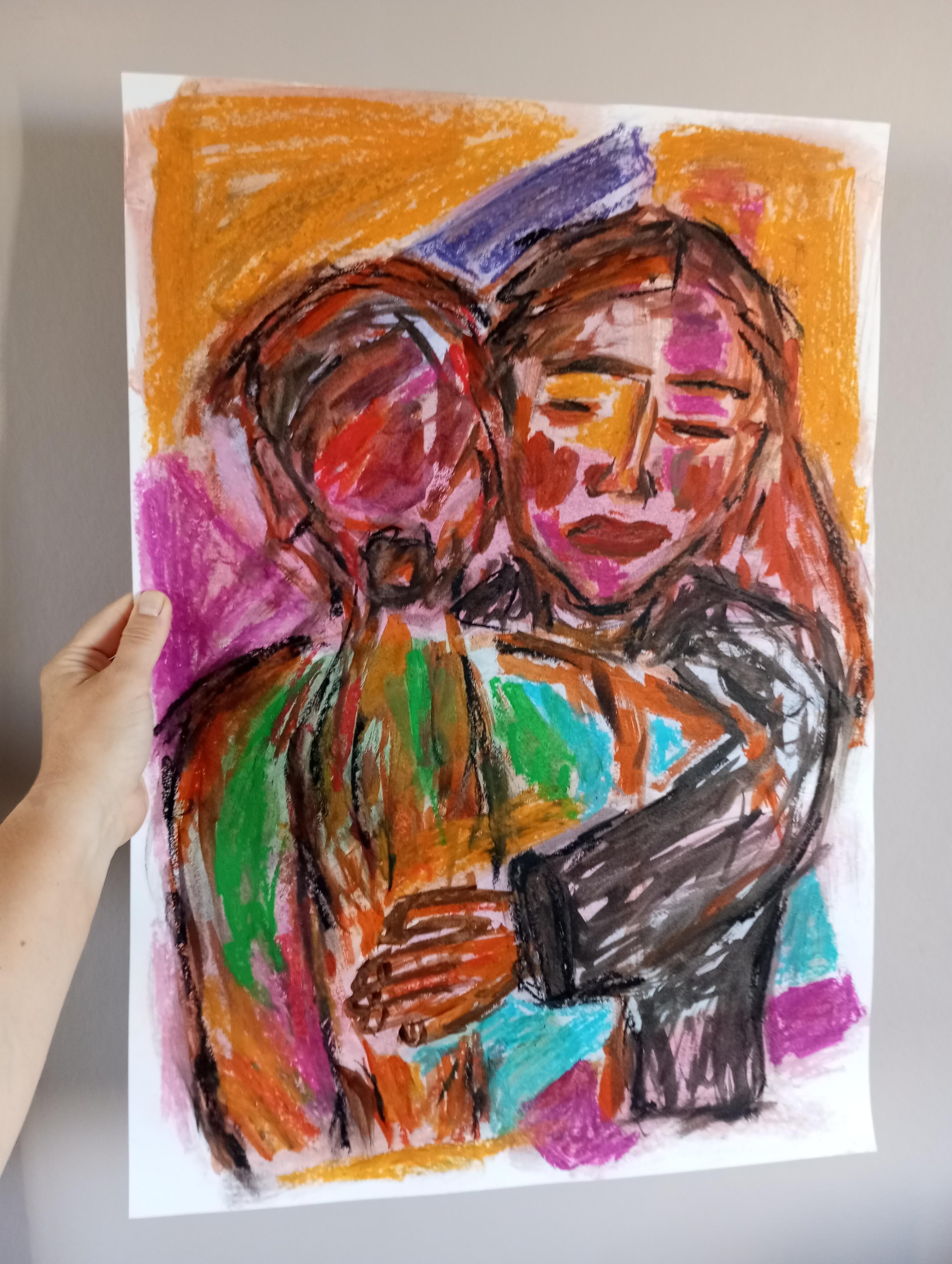 Two women hugging each other painting on paper 