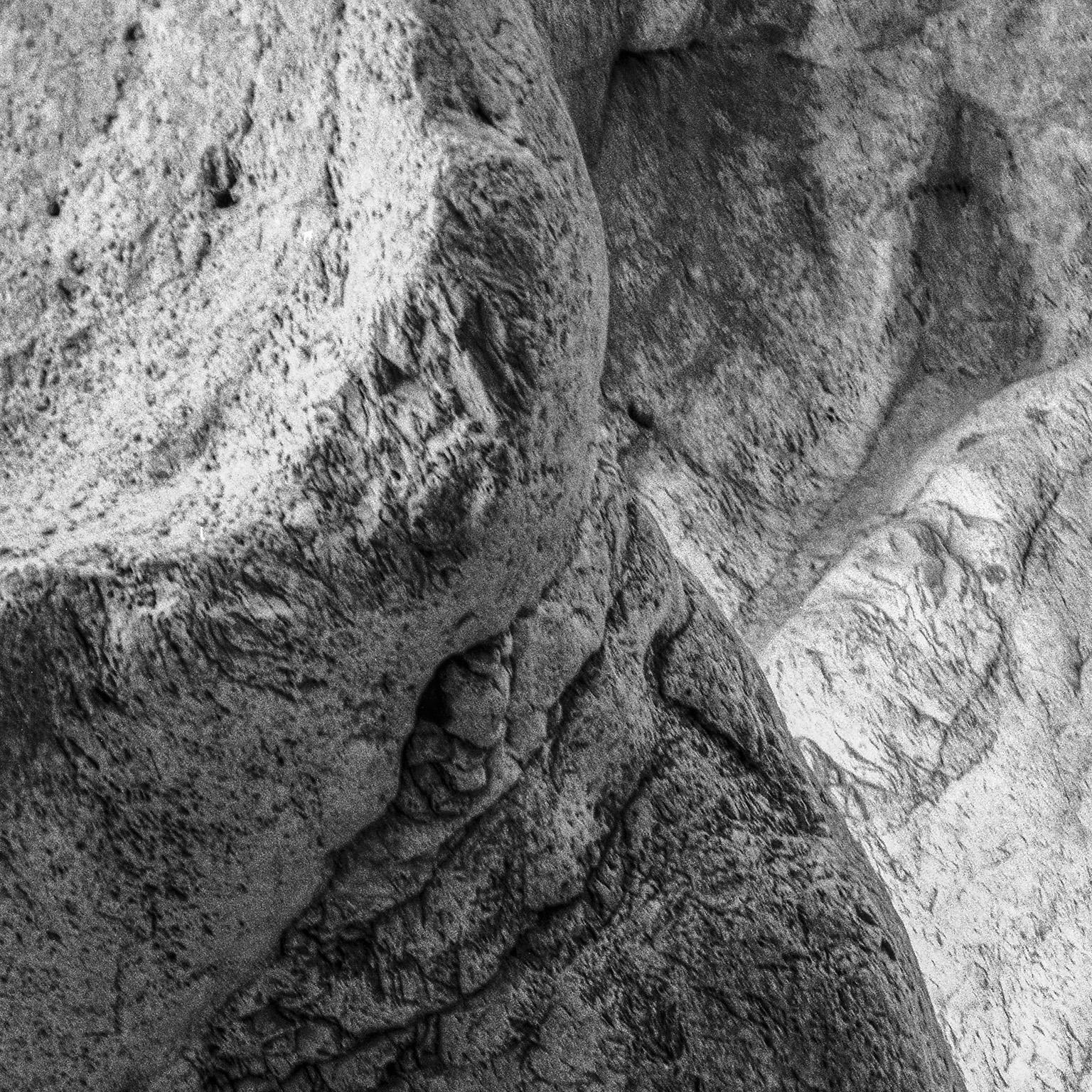 Homage to Heraclitus: Earth V - Black and White Landscape Photograph of a Cave - Gray Black and White Photograph by John Stathatos