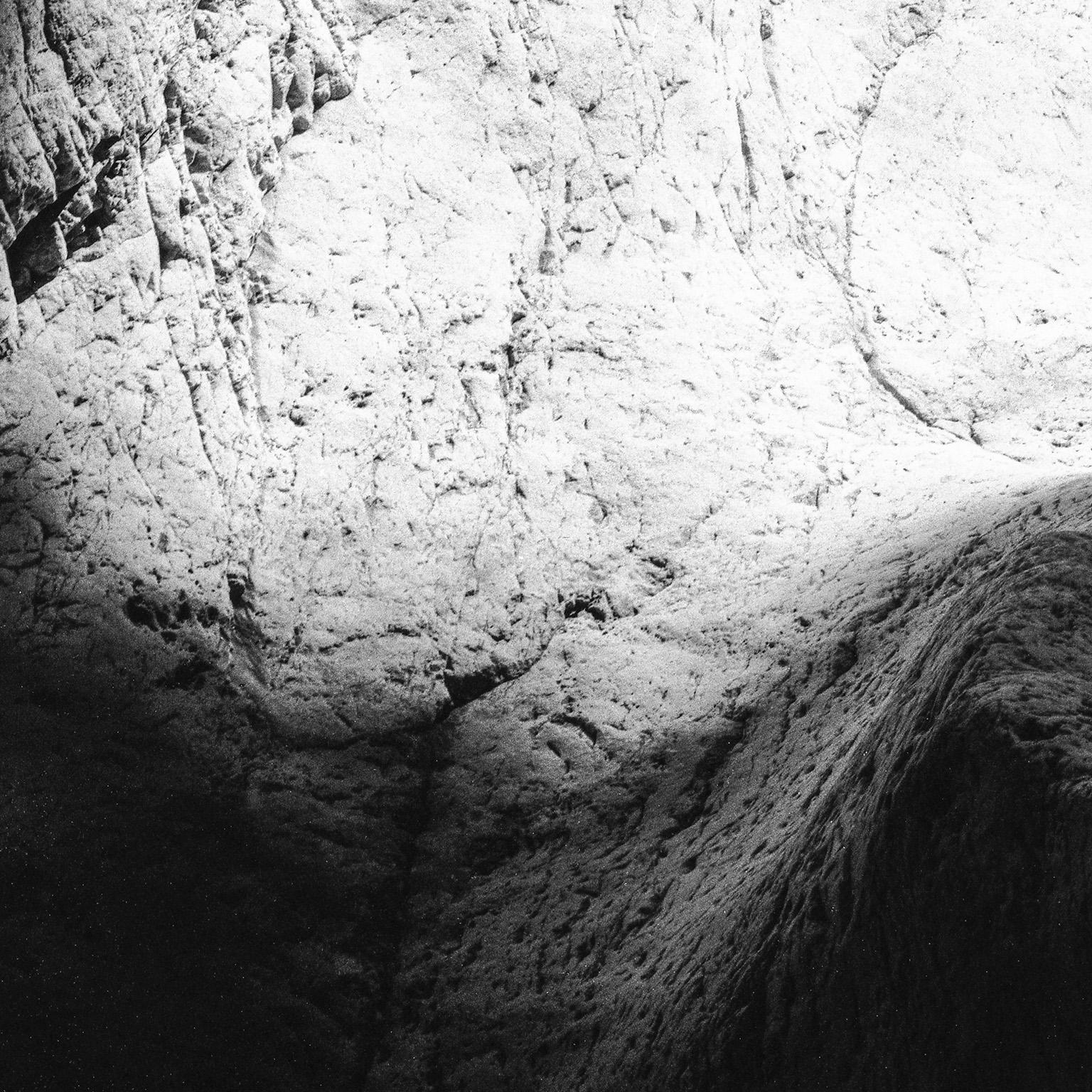 Earth VI - Black and White Photograph, Cave, Rocks, Natural Landscape, Light For Sale 1