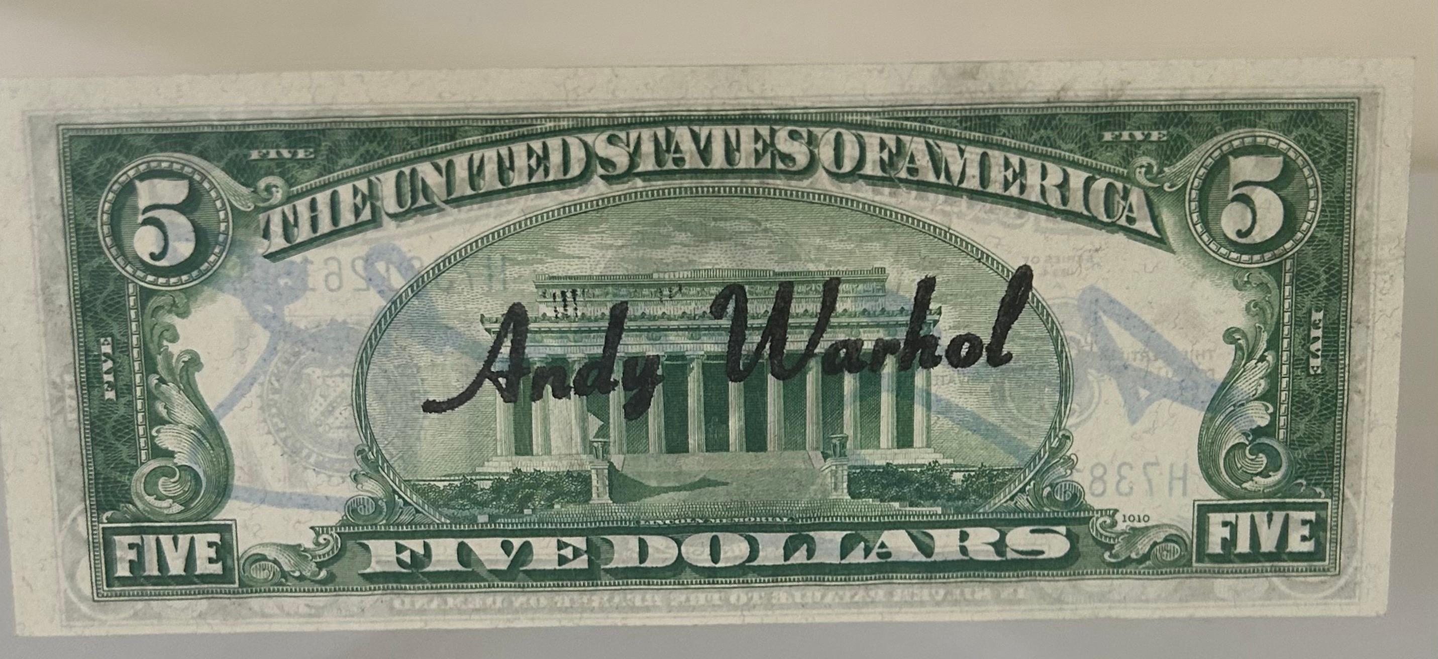 Five dollars bill
Signed in blue felt pen
Factory Warhol stamp on the back
Series number H73812615A
Framed in plexiglass

A certificate of authenticity from Galerie 32 will be given with the item.


Obsessed with celebrity, consumer culture, and
