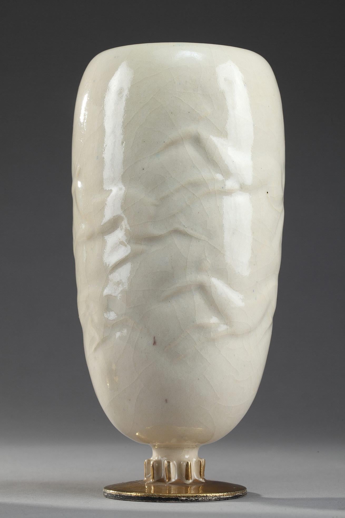 Pair of vases
by Jean MAYODON (1893–1967)

Pair of white tin-glazedearthenware vases
decorated with deer treated in relief,
green interiors and gilded feet.

France
1st half of the 20th century

height 19 cm
diameter 9 cm

Biography :
Jean Mayodon
